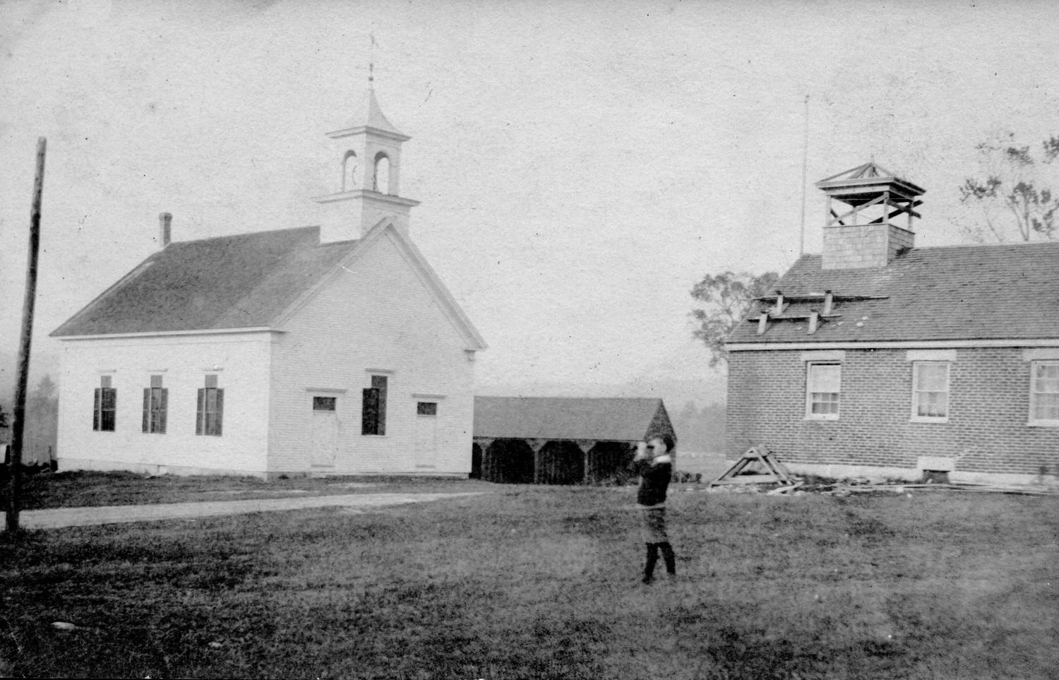 Spurrs Corner Church, 1872, and brick schoolhouse, probably built 1839 and replaced sometime later by a wooden building. The church was then a Congregational Church; it is now part of the Christian and Missionary Alliance