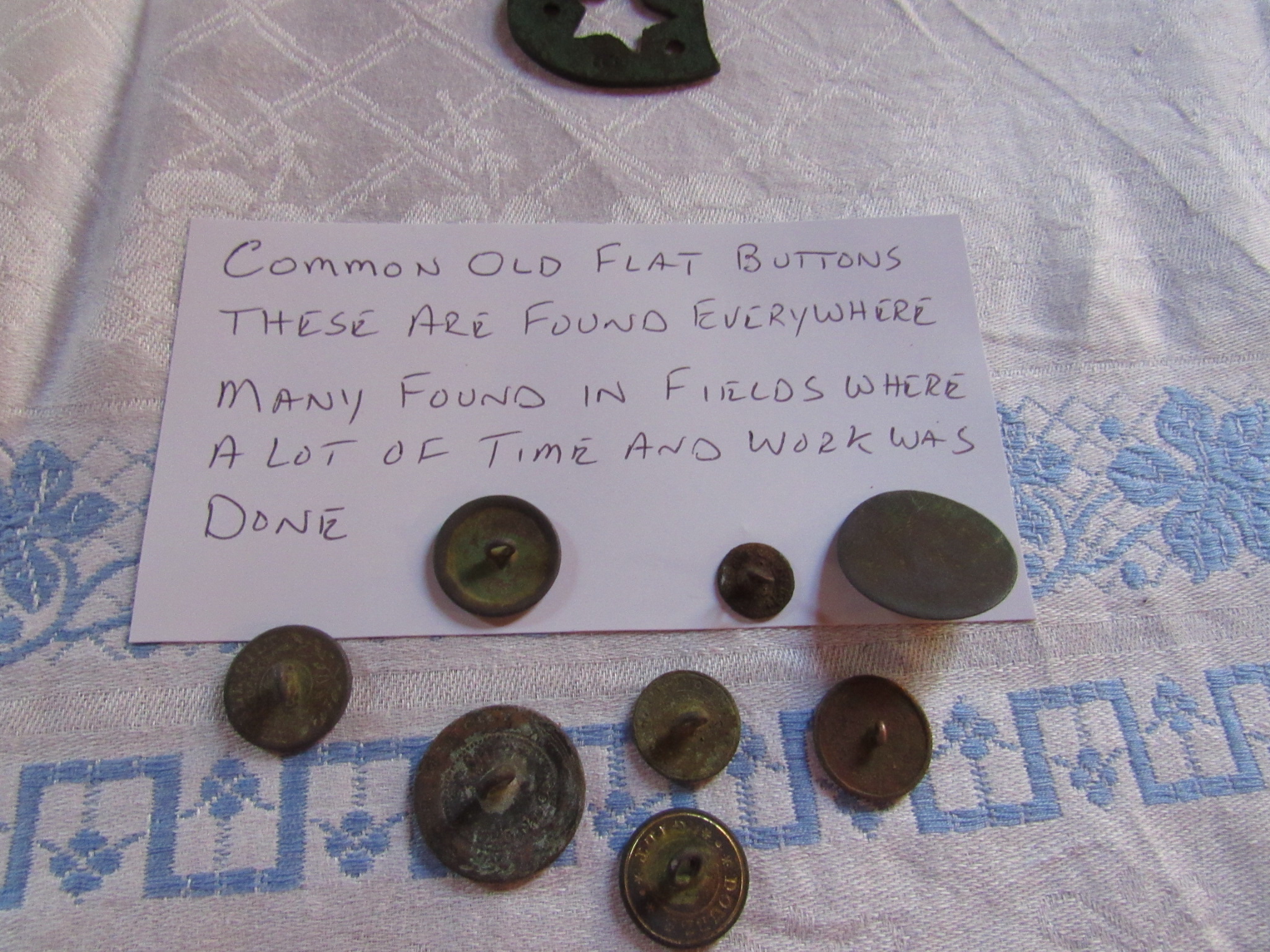 Common old, flat buttons. These are found everywhere. Many found in fields where a lot of time and work was done.
