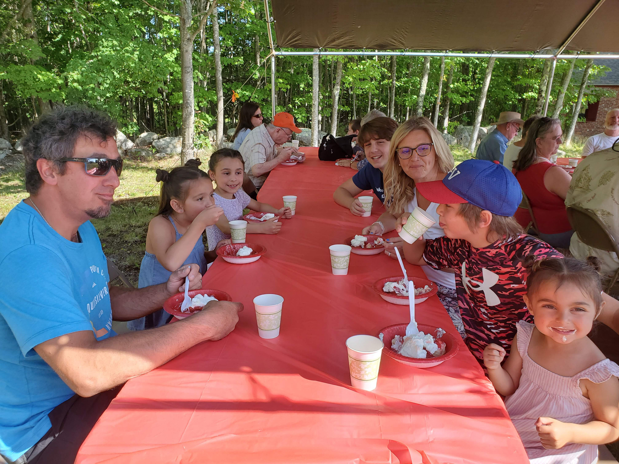 Guests gathered outdoors for refreshments at the Strawberry Festival at Bell Hill Meetinghouse.