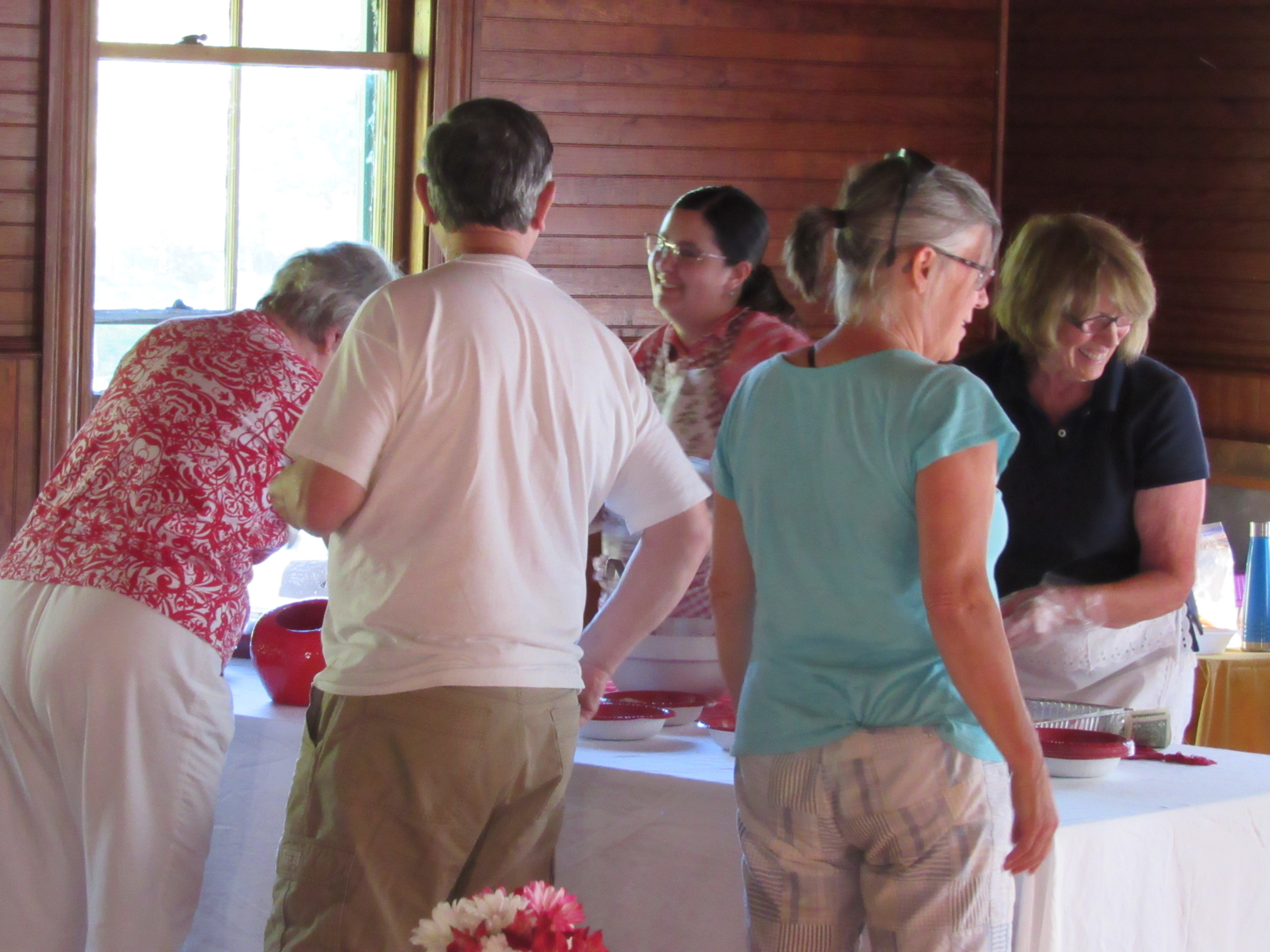 Directors Maureen Howard and Jess Dorr serve patrons at the Annual Strawberry Festival