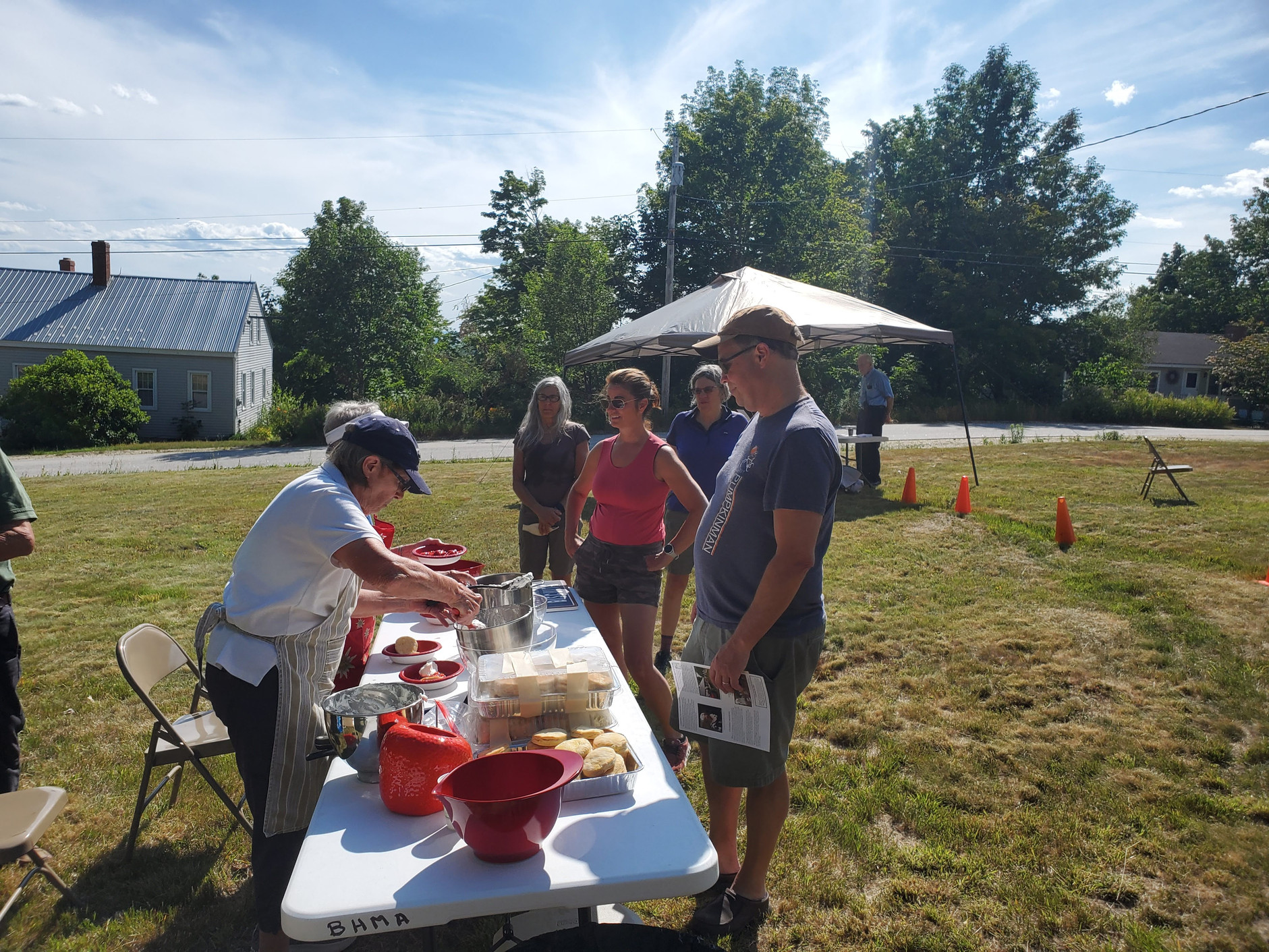 Serving refreshments outdoors — likely Strawberry Festival