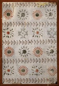 Moses Eaton stencils on plaster, from the Smithsonian American Art collection. Plaster fragment decorated with rows of sunflower and leaf motifs.