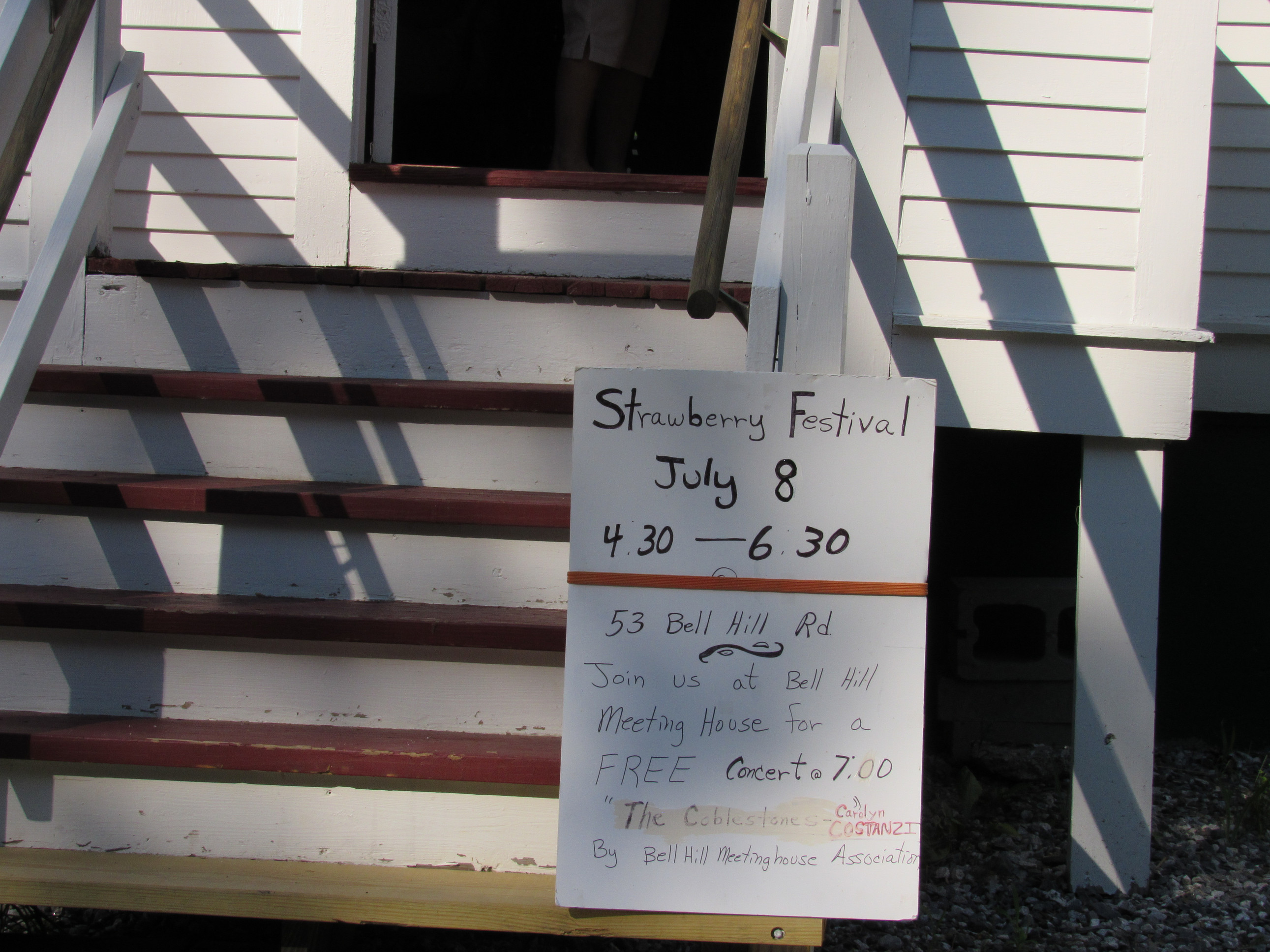 Photograph of Strawberry Festival and Bell Hill concert sign, July 8.