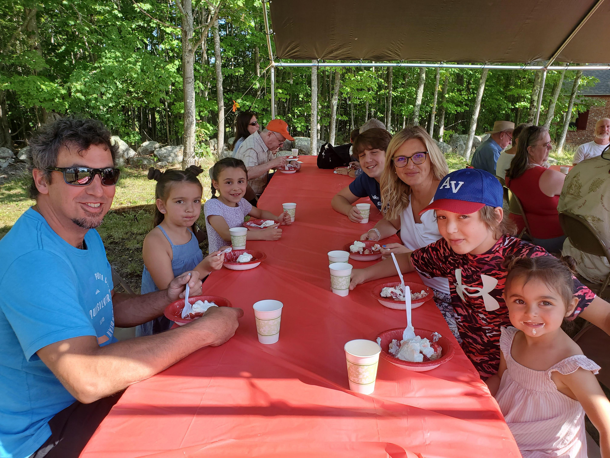 Guests gathered outdoors for refreshments at the Strawberry Festival at Bell Hill Meetinghouse.