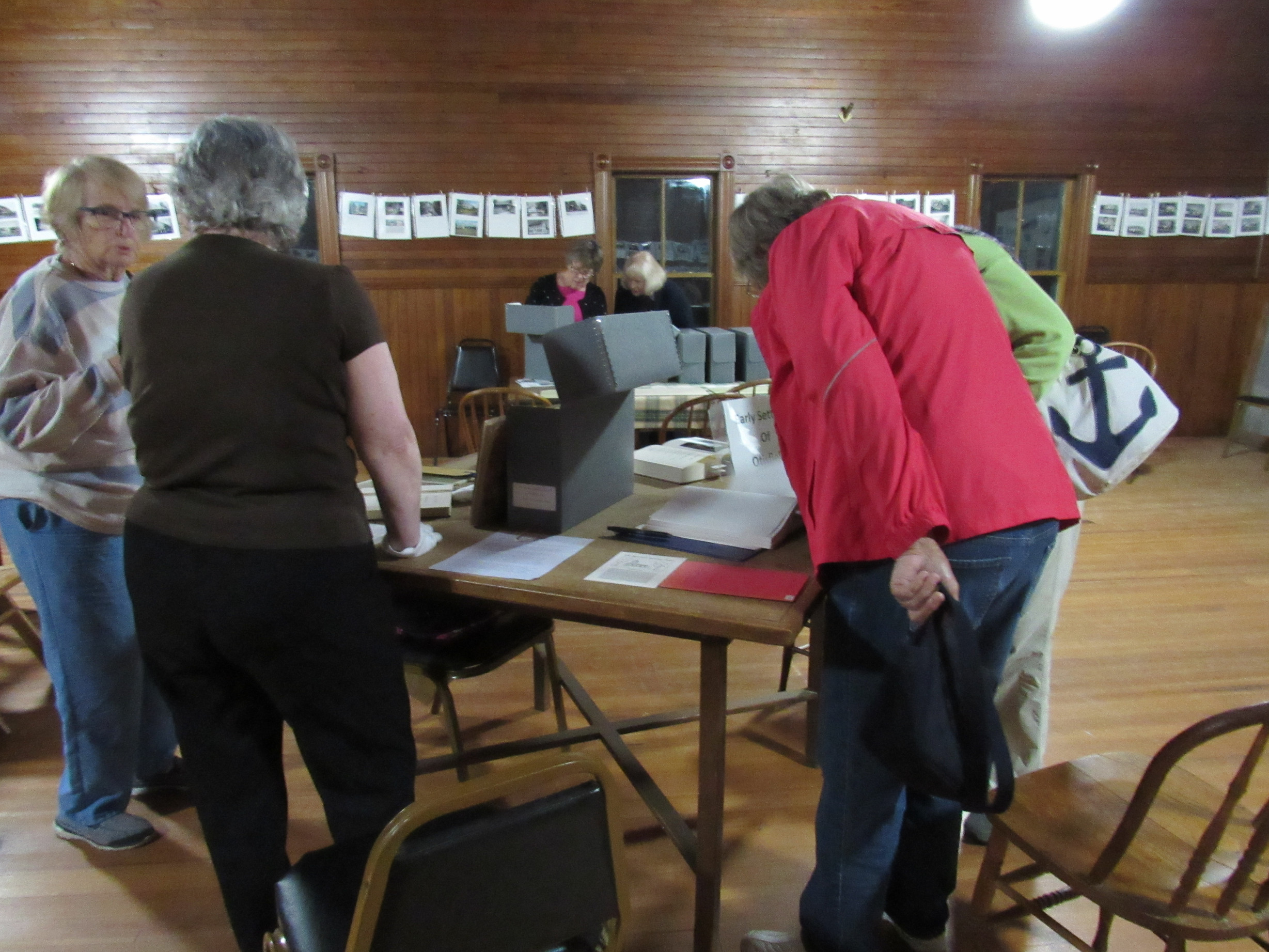 Visitors examining historical society archives