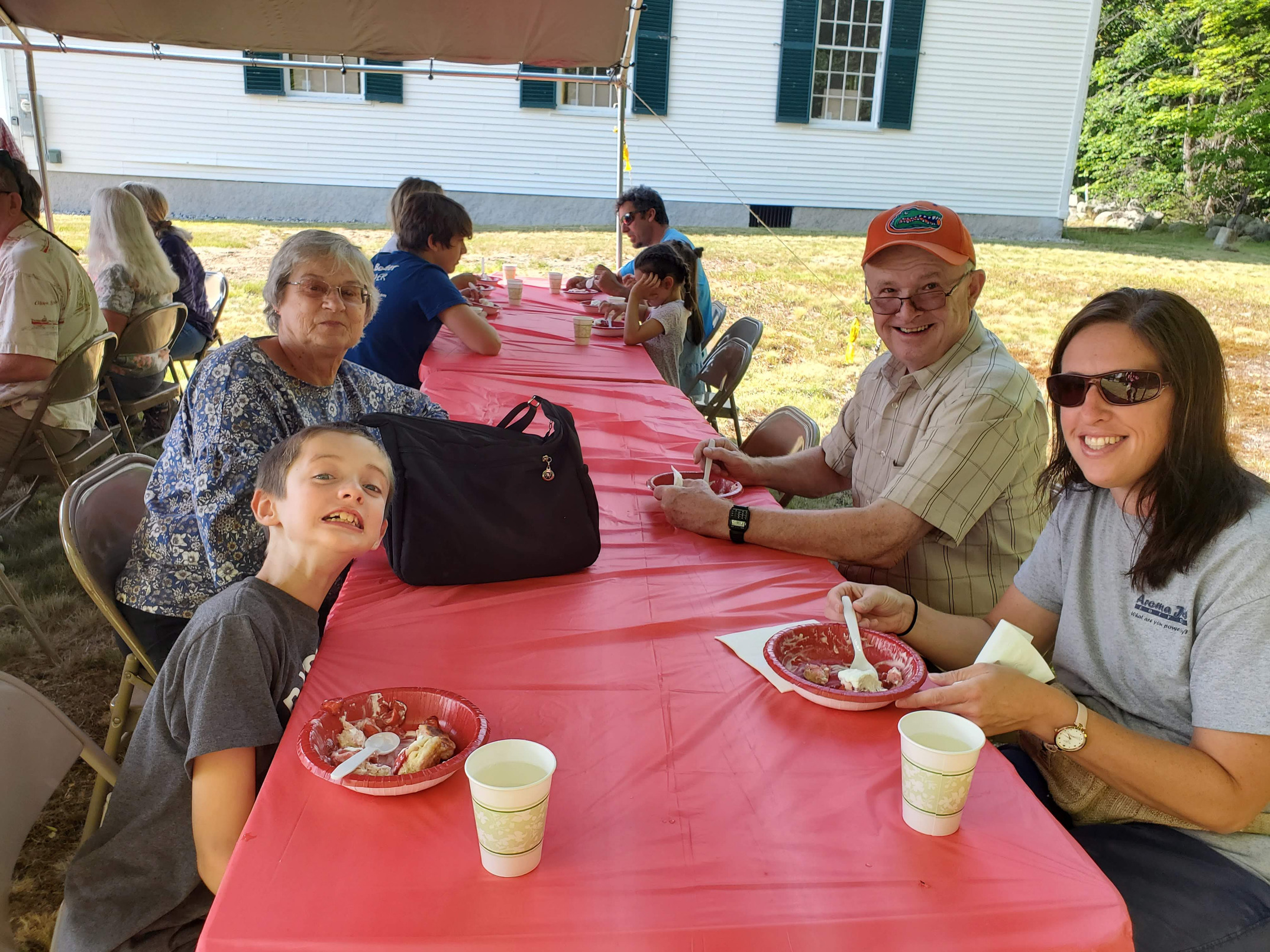 Guests gathered outdoors for refreshments at the Strawberry Festival at Bell Hill Meetinghouse.