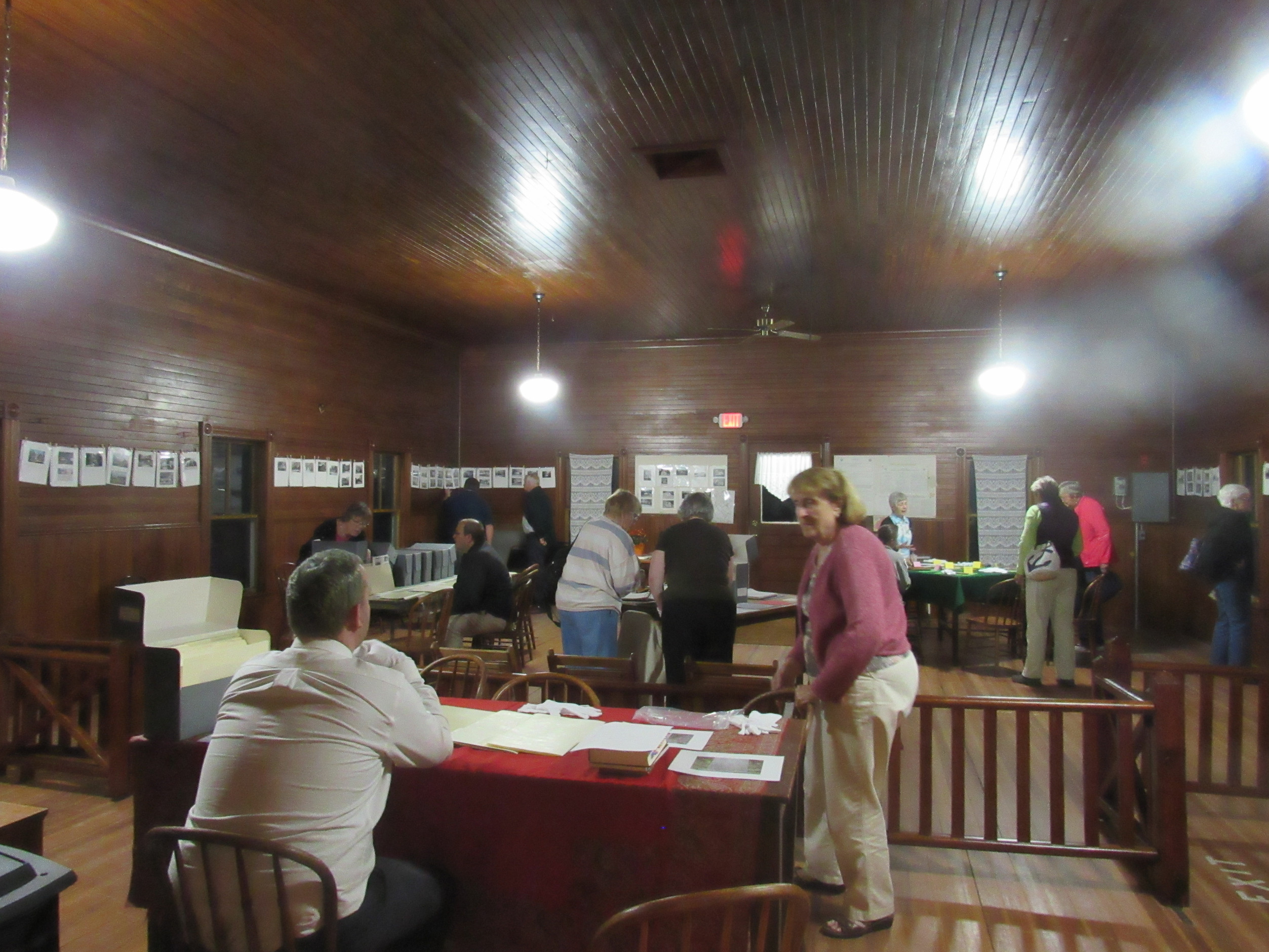 Visitors examining historical society archives