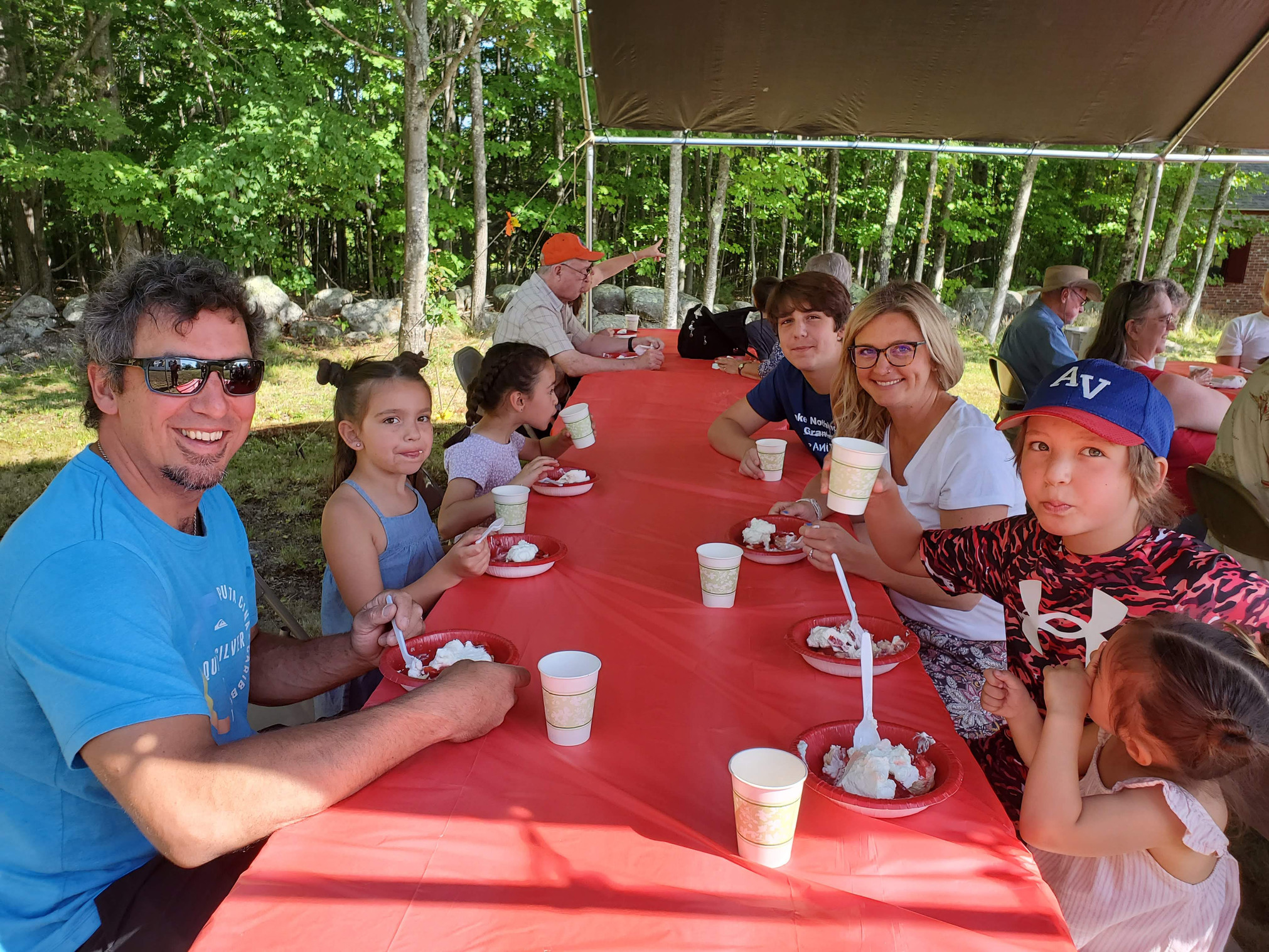 Guests gathered outdoors for refreshments at the Strawberry Festival at Bell Hill Meetinghouse.