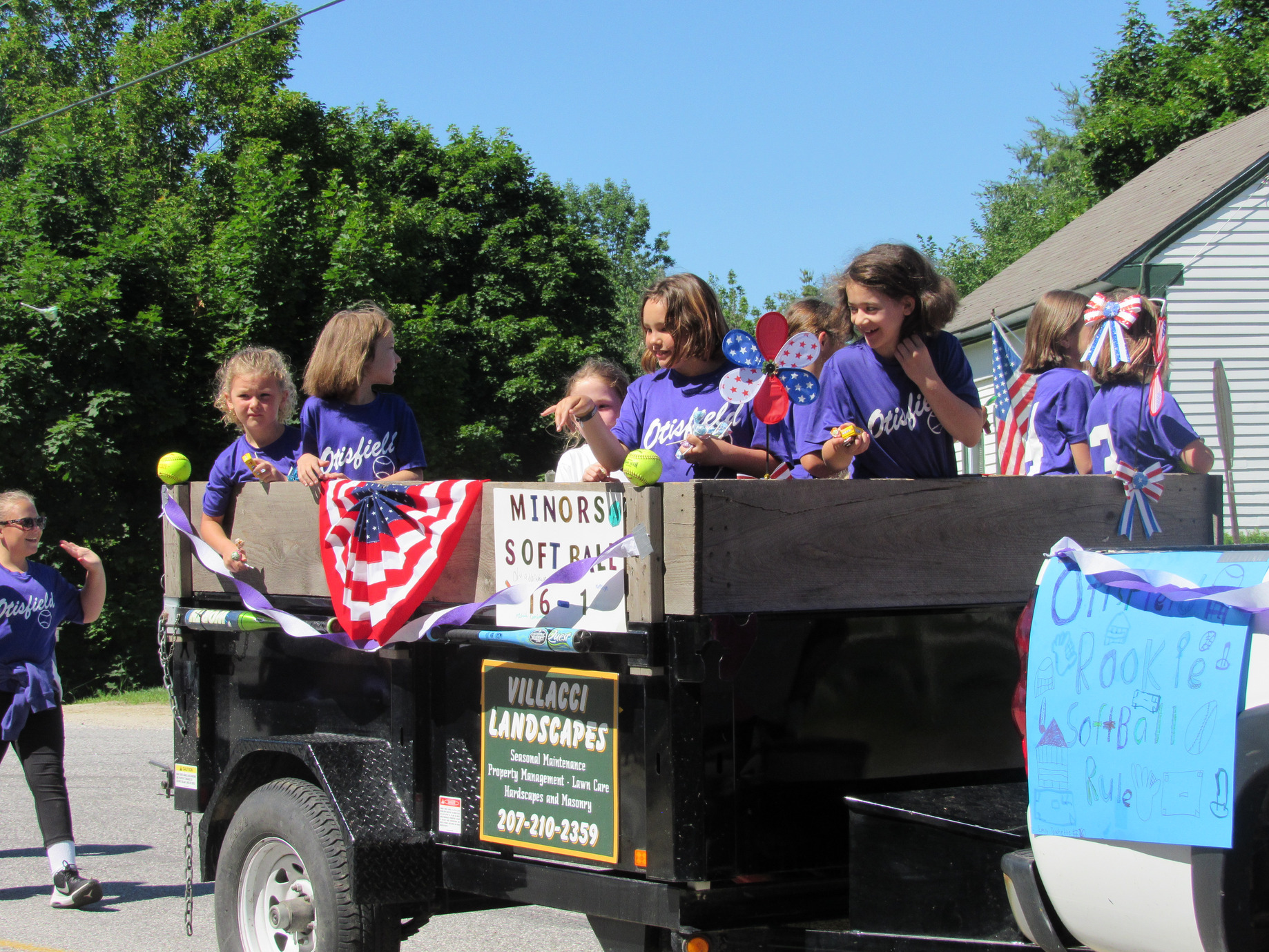 Otisfield softball float on a Villacci Landscapes trailer at the Fourth of July parade.