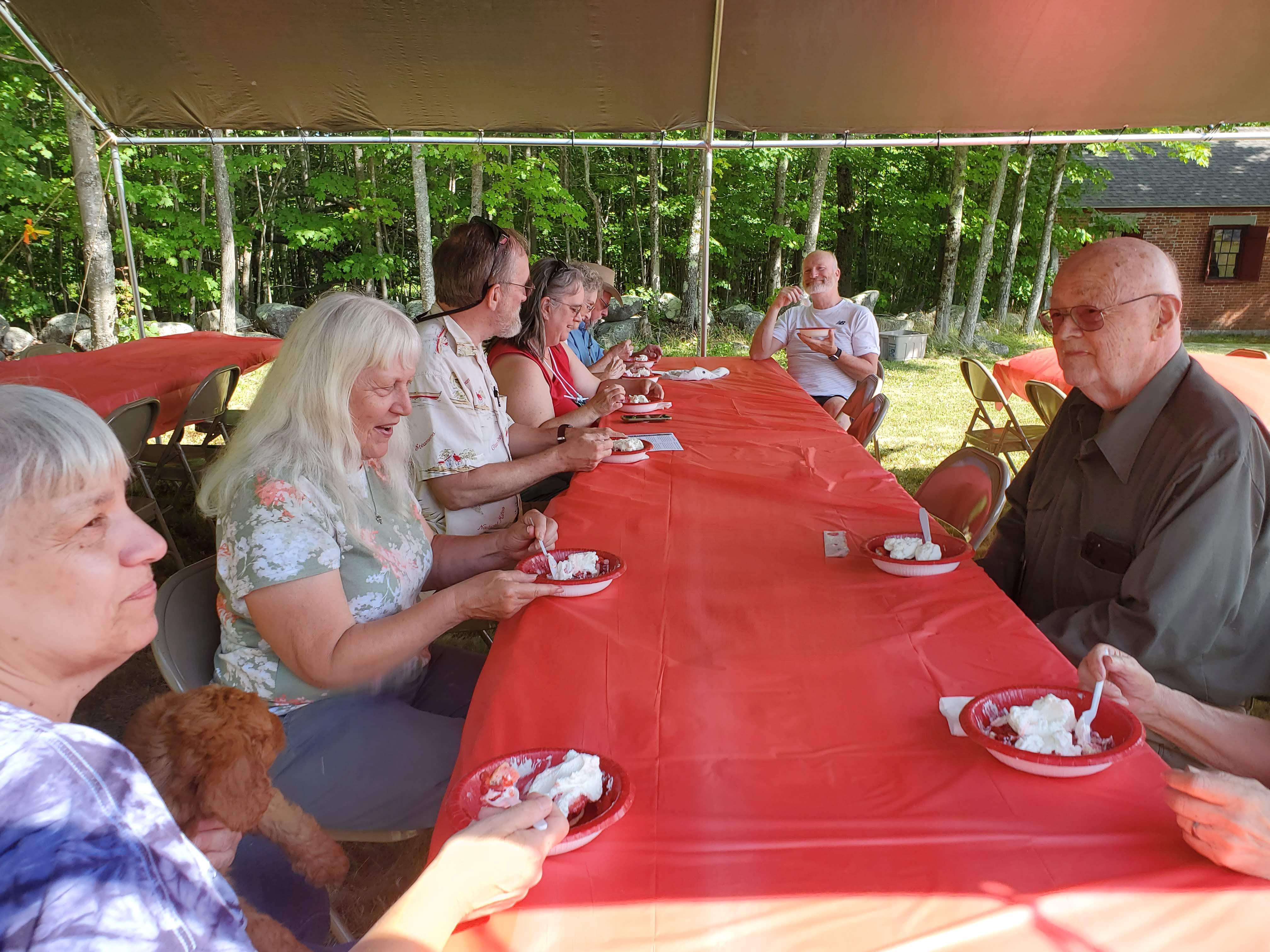 Guests gathered outdoors for refreshments at the Strawberry Festival at Bell Hill Meetinghouse.