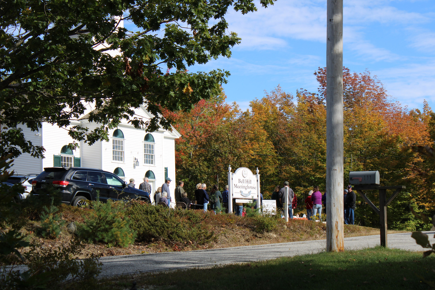 A tour group gathered to hear the history of the Bell Hill Meetinghouse