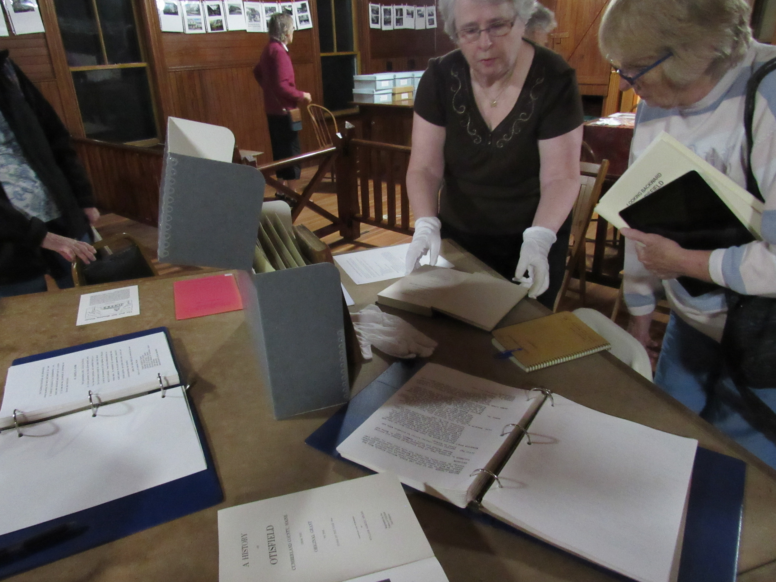 Visitors examining historical society archives