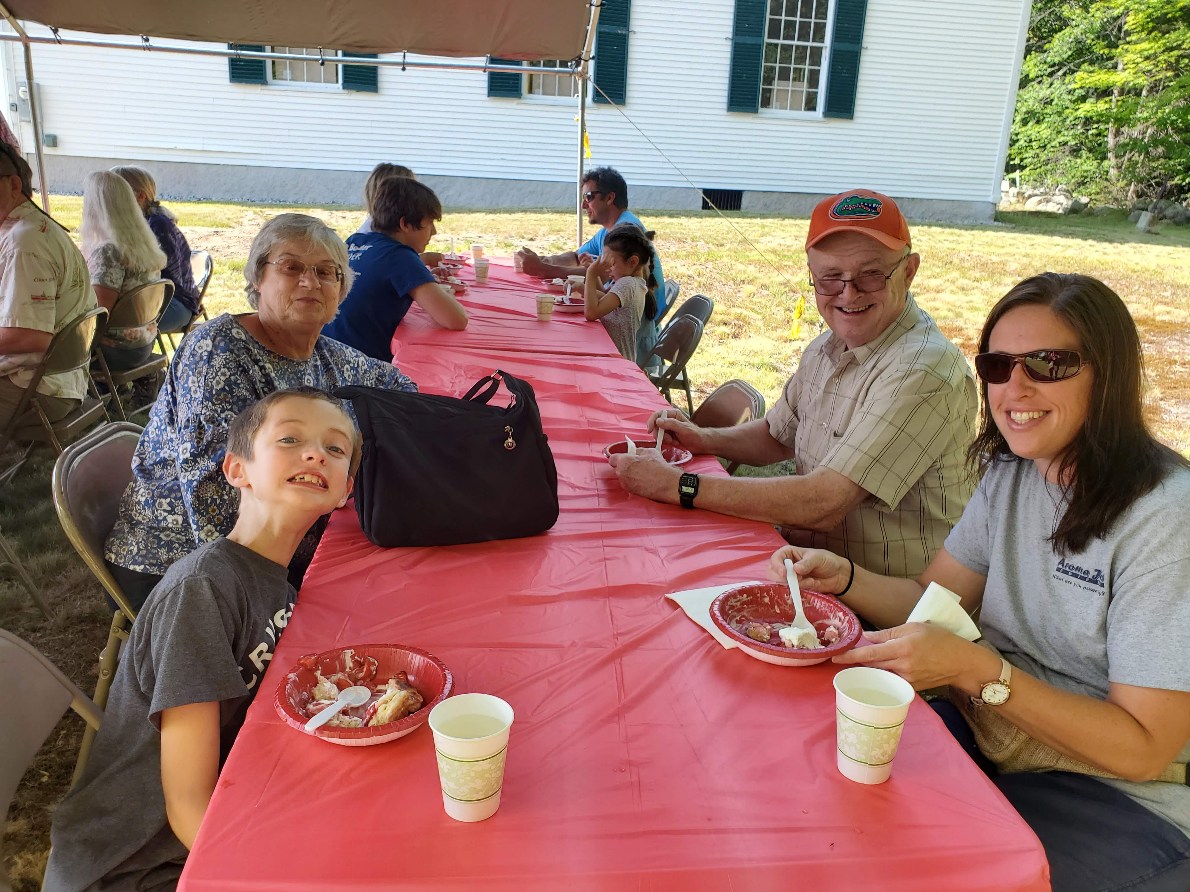 Guests gathered outdoors for refreshments at the Strawberry Festival at Bell Hill Meetinghouse.