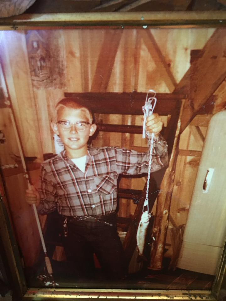 Ken Bartow in the kitchen at his grandparent’s summer camp on Thompson Lake showing off his big catch in 1966 Donated by Polly Bartow