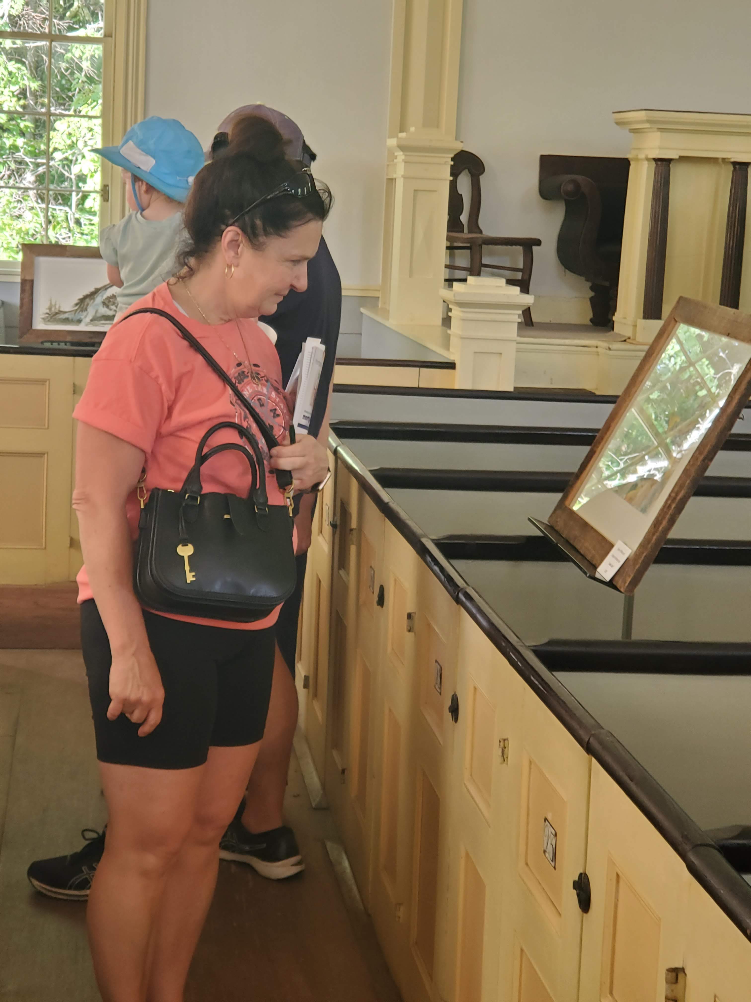 Visitors and displays inside the meetinghouse
