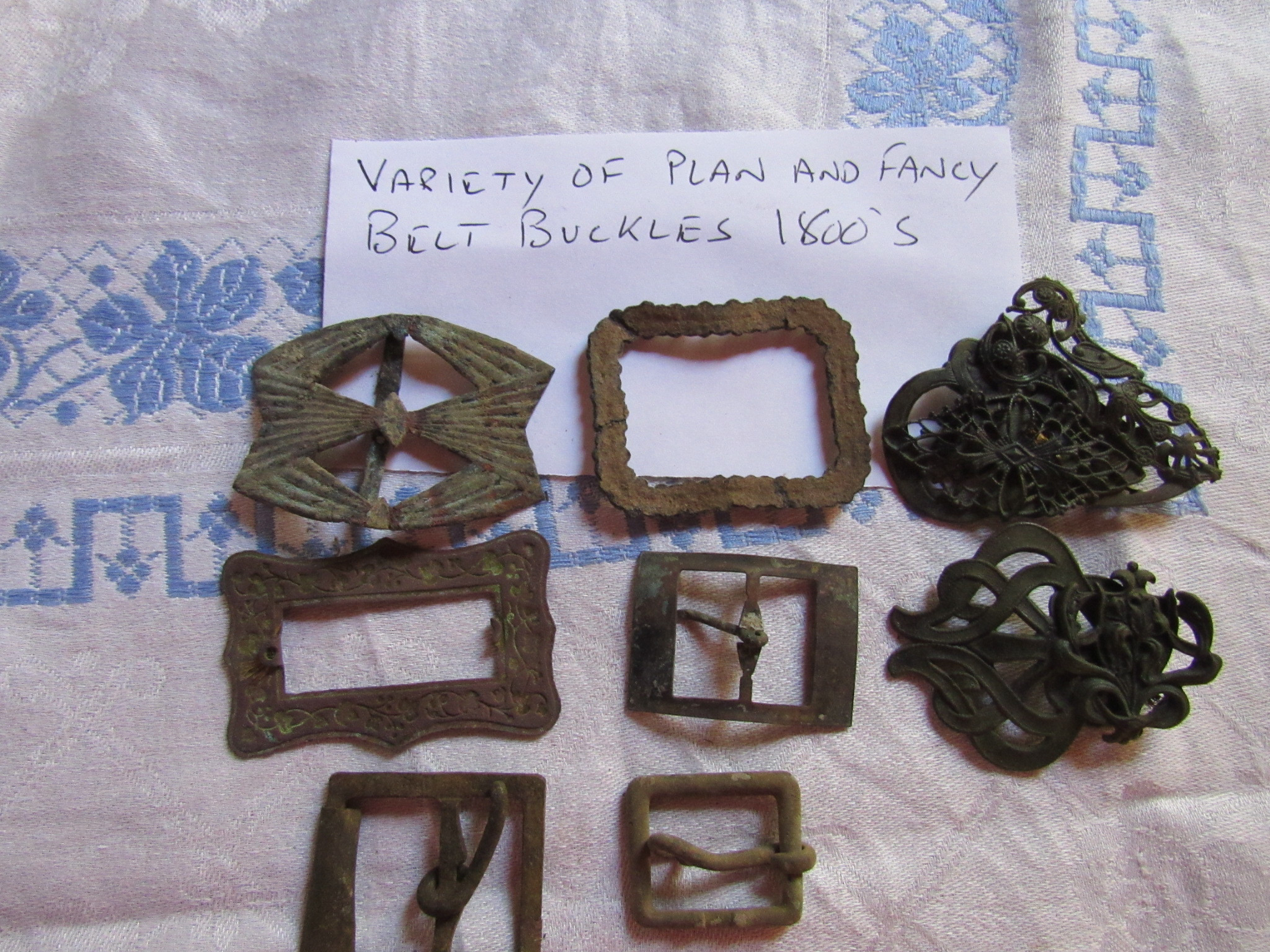 Variety of plain and fancy belt buckles, 1800s