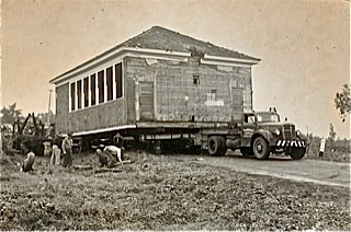 Spurrs Corner Schoolhouse being moved to join with the Central School at East Otisfield. This is now part of the Otisfield Town Office