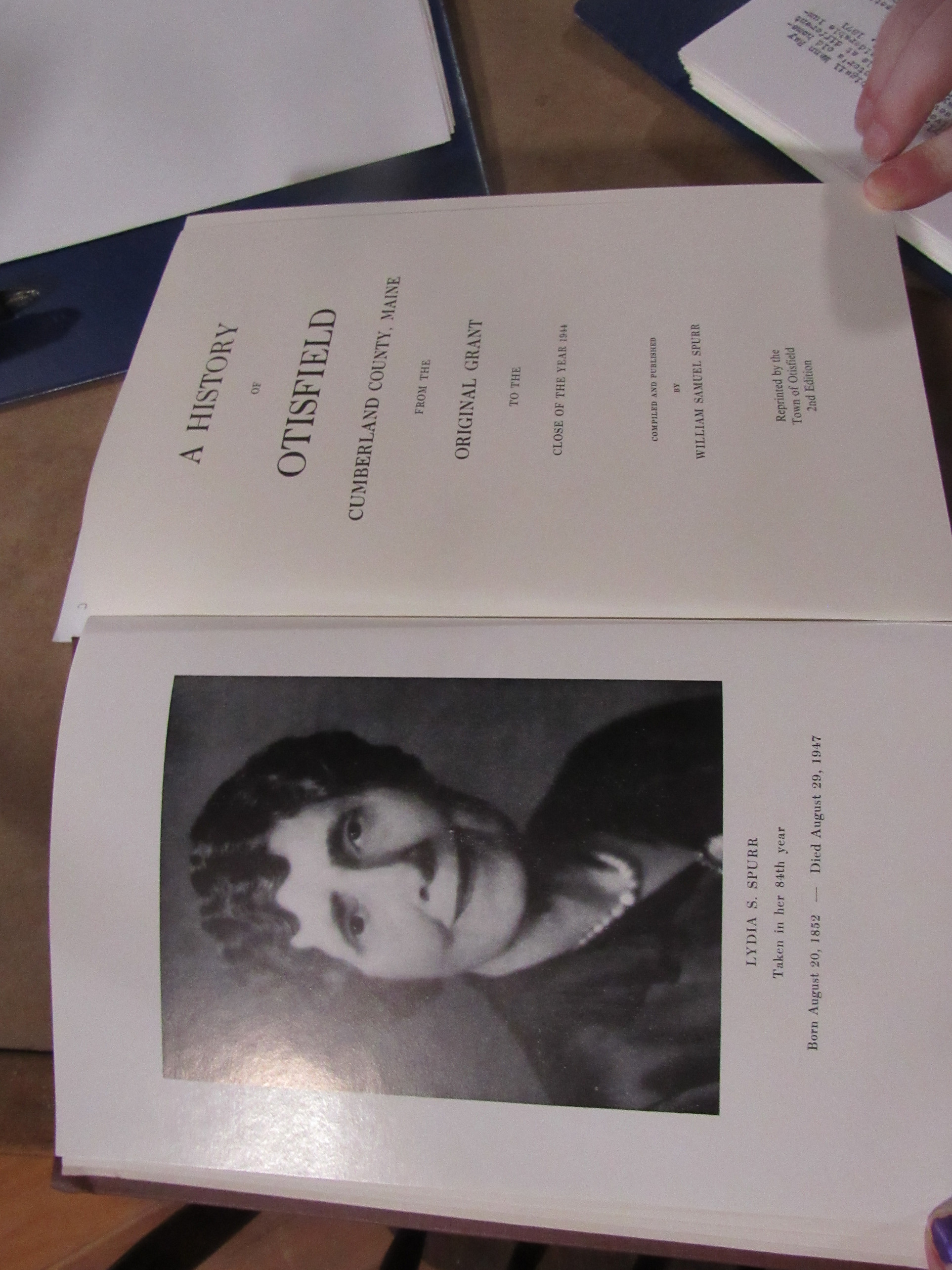 Photograph of A History of Otisfield title page and Lydia S. Spurr portrait.