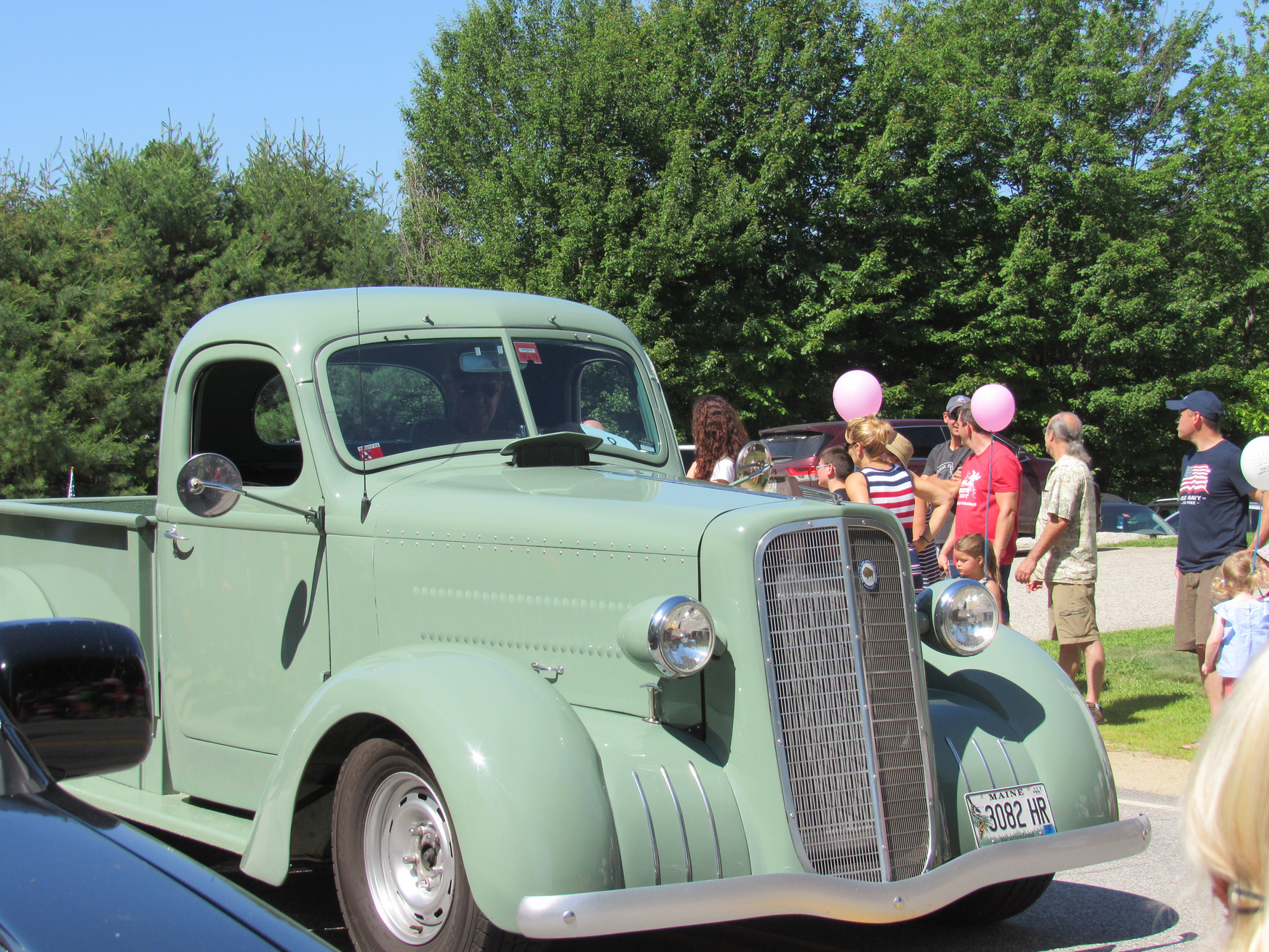 Vintage pickup truck in the parade at the Fourth of July parade.