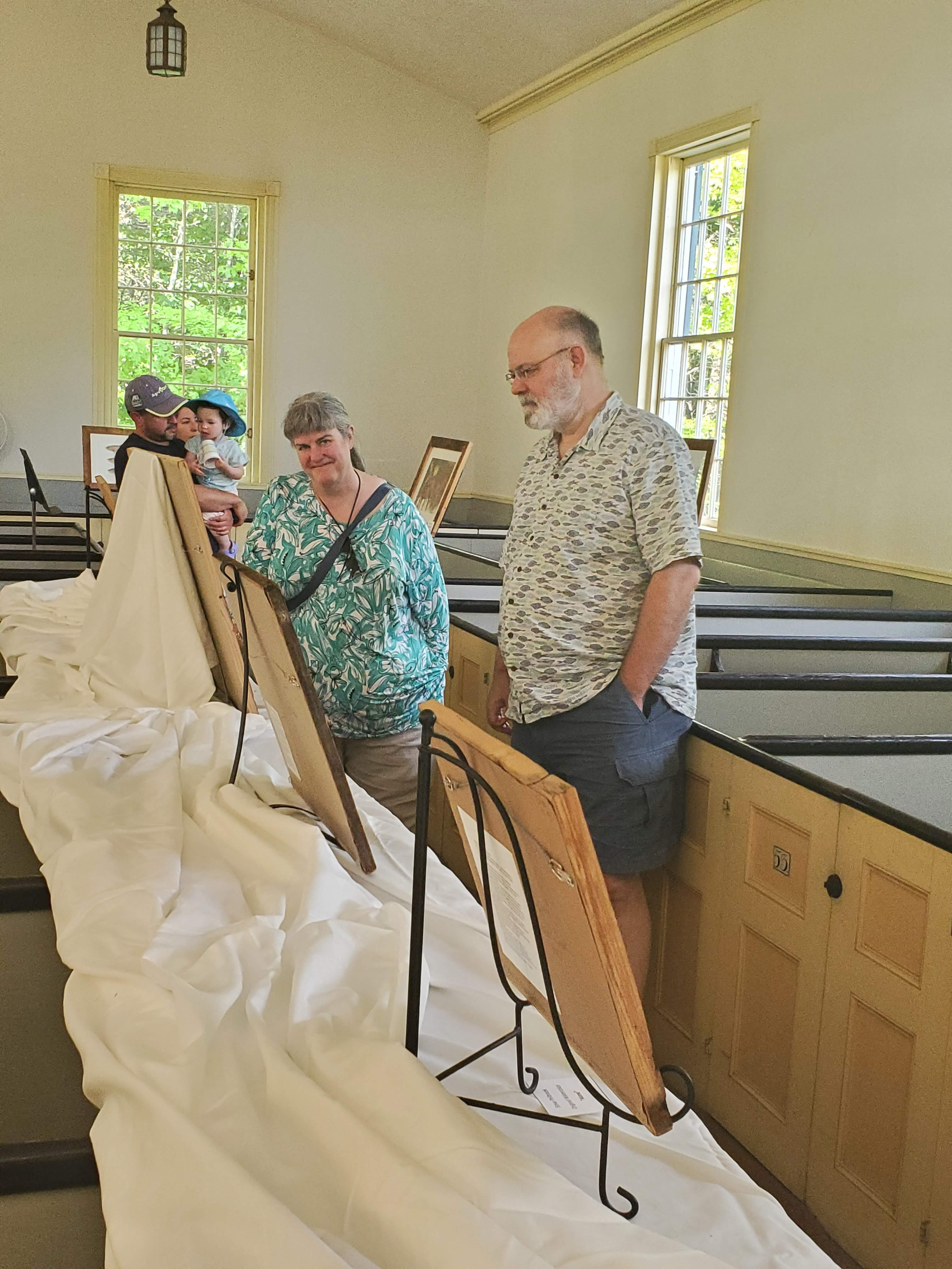 Visitors and displays inside the meetinghouse
