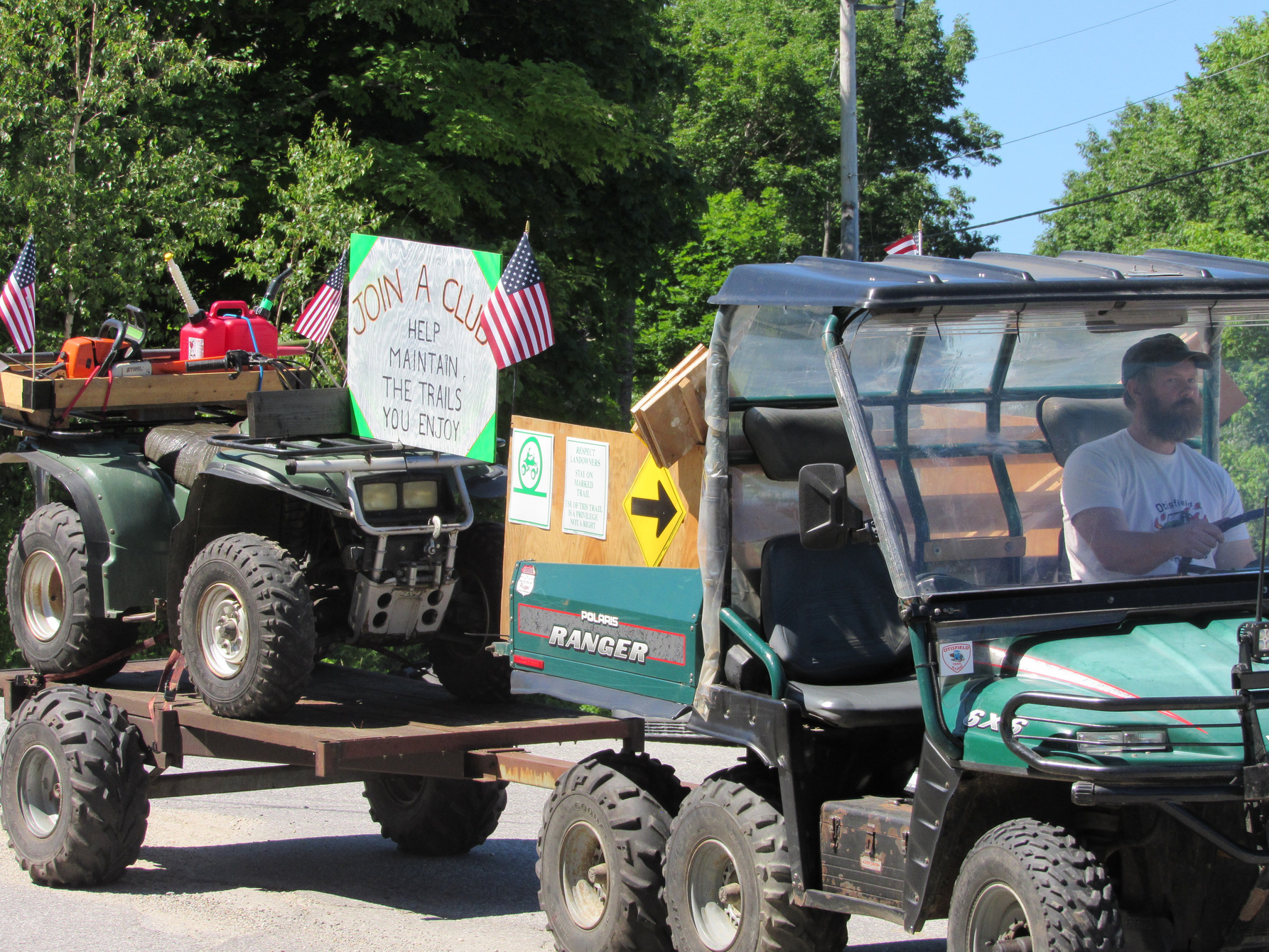 Side-by-side utility vehicle in the parade at the Fourth of July parade.