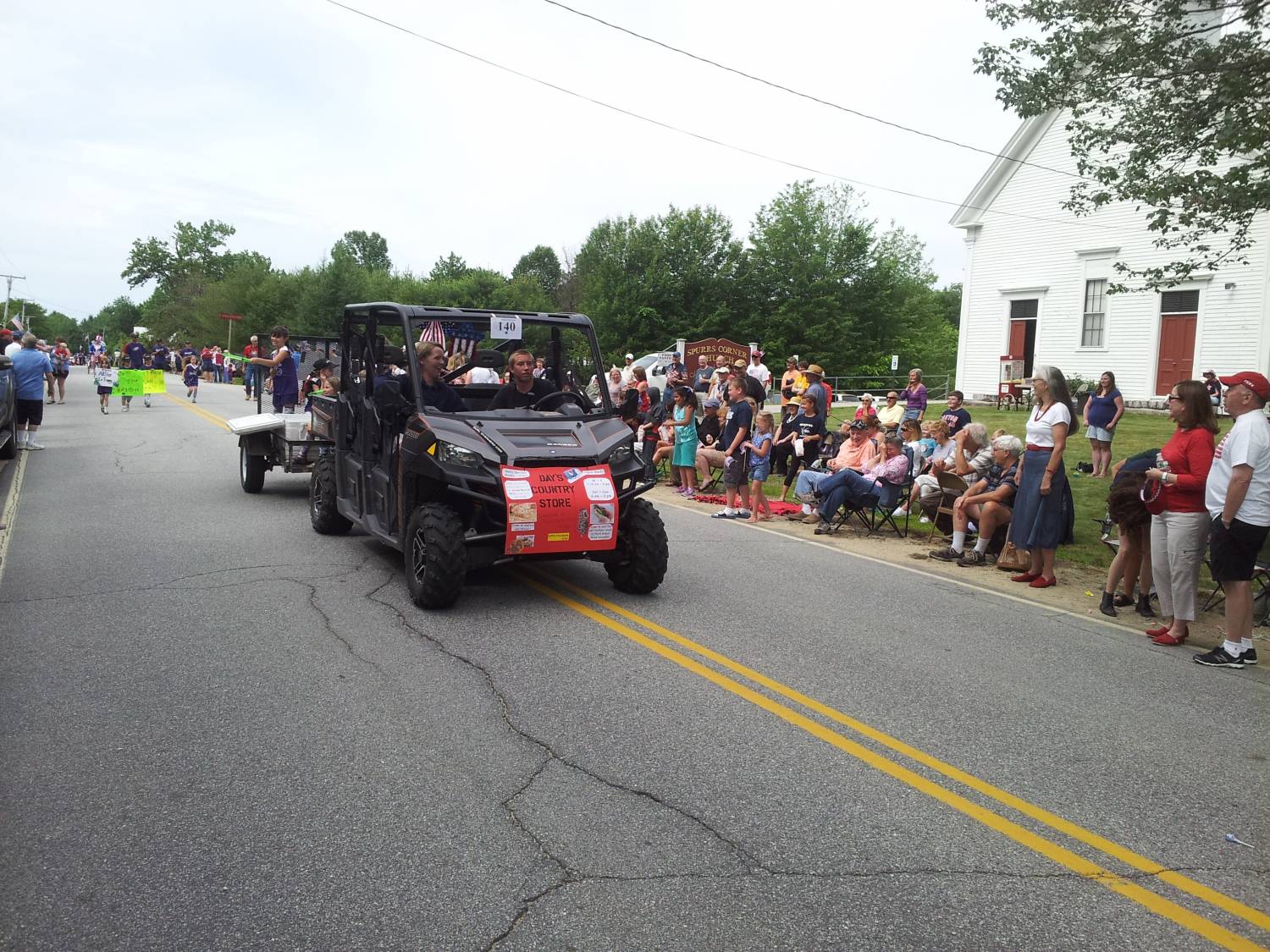 Side-by-side utility vehicle in the parade at the Fourth of July parade.