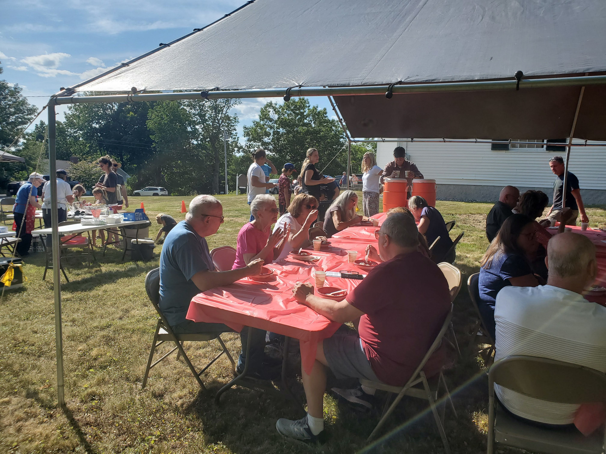 Guests gathered outdoors for refreshments at the Strawberry Festival at Bell Hill Meetinghouse.