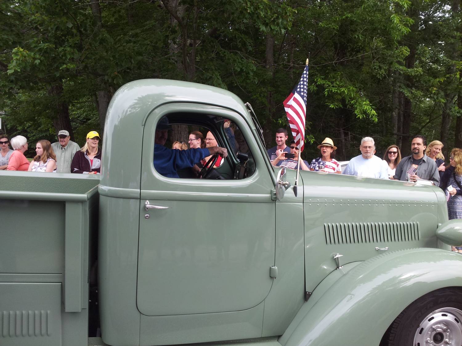 Vintage pickup truck in the parade at the Fourth of July parade.