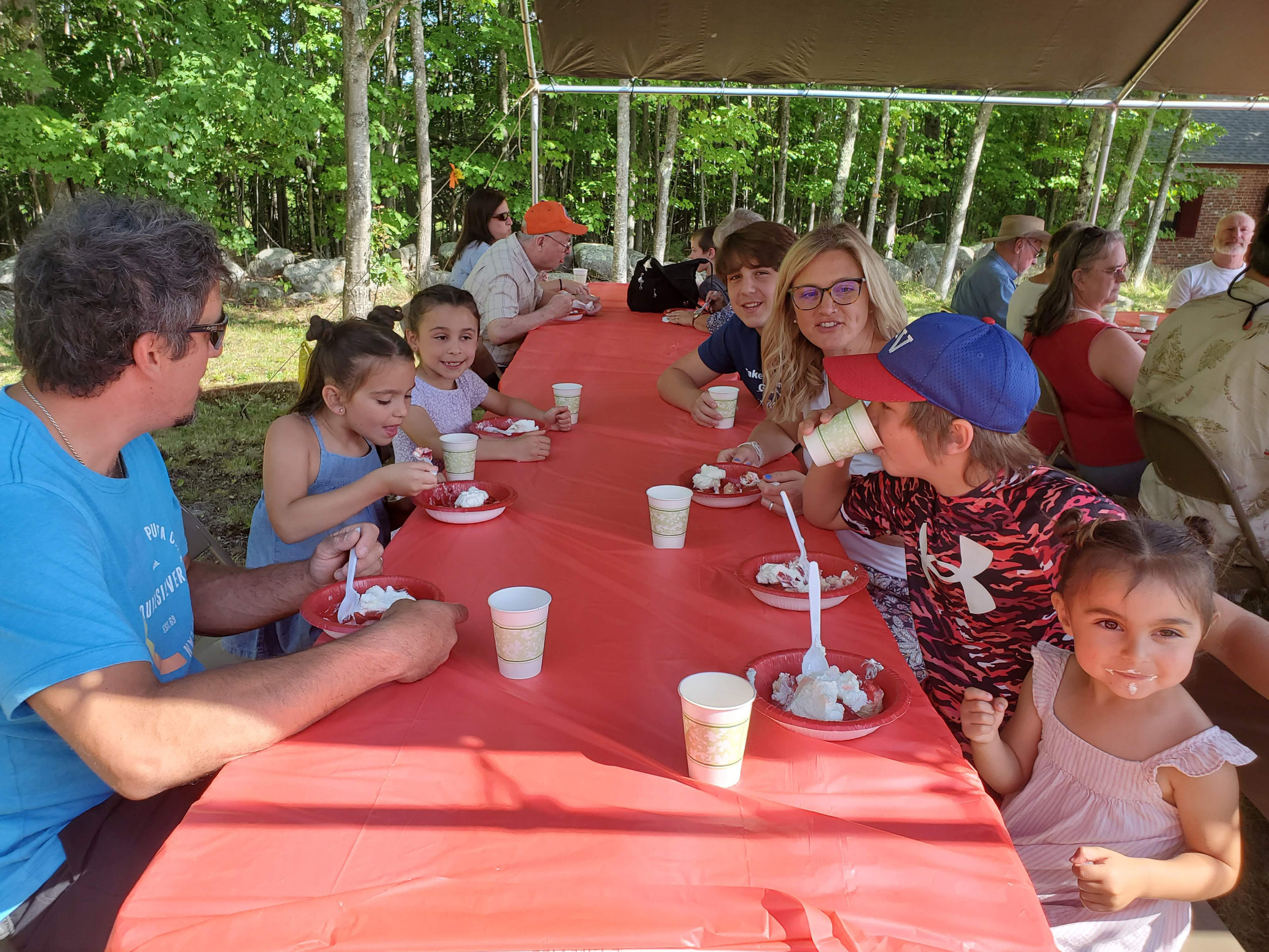 Guests gathered outdoors for refreshments at the Strawberry Festival at Bell Hill Meetinghouse.