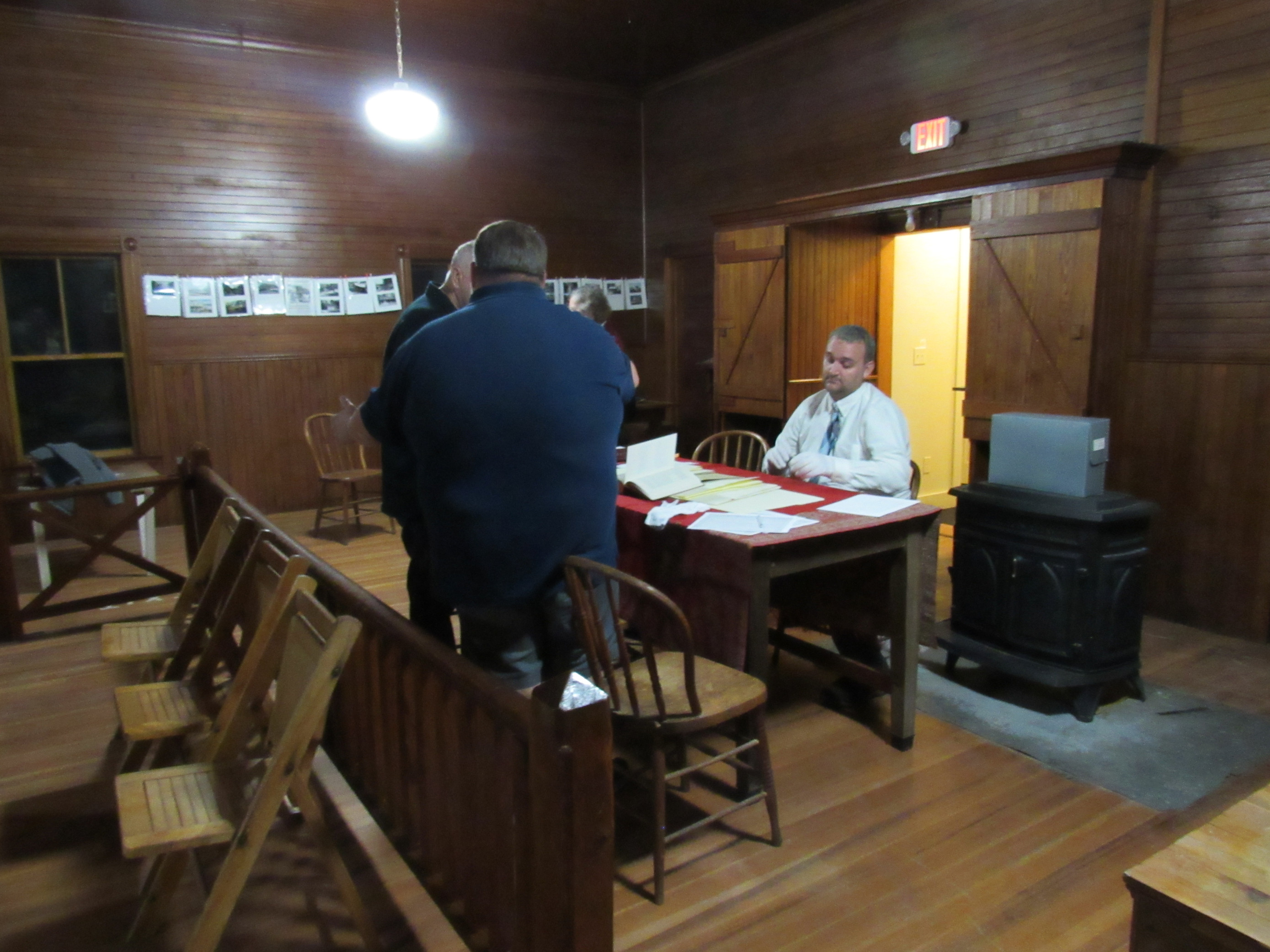 Visitors examining historical society archives