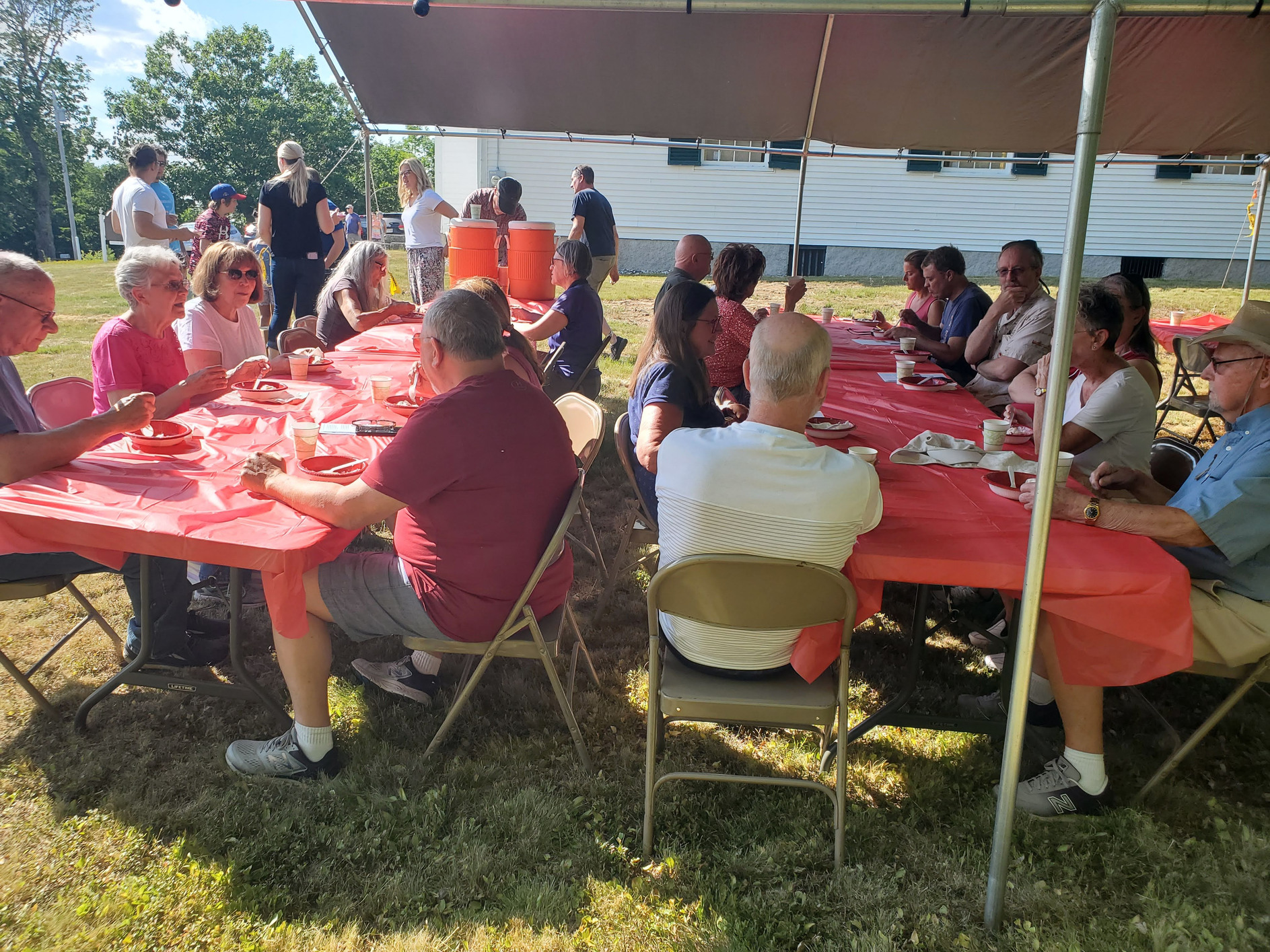 Guests gathered outdoors for refreshments at the Strawberry Festival at Bell Hill Meetinghouse.