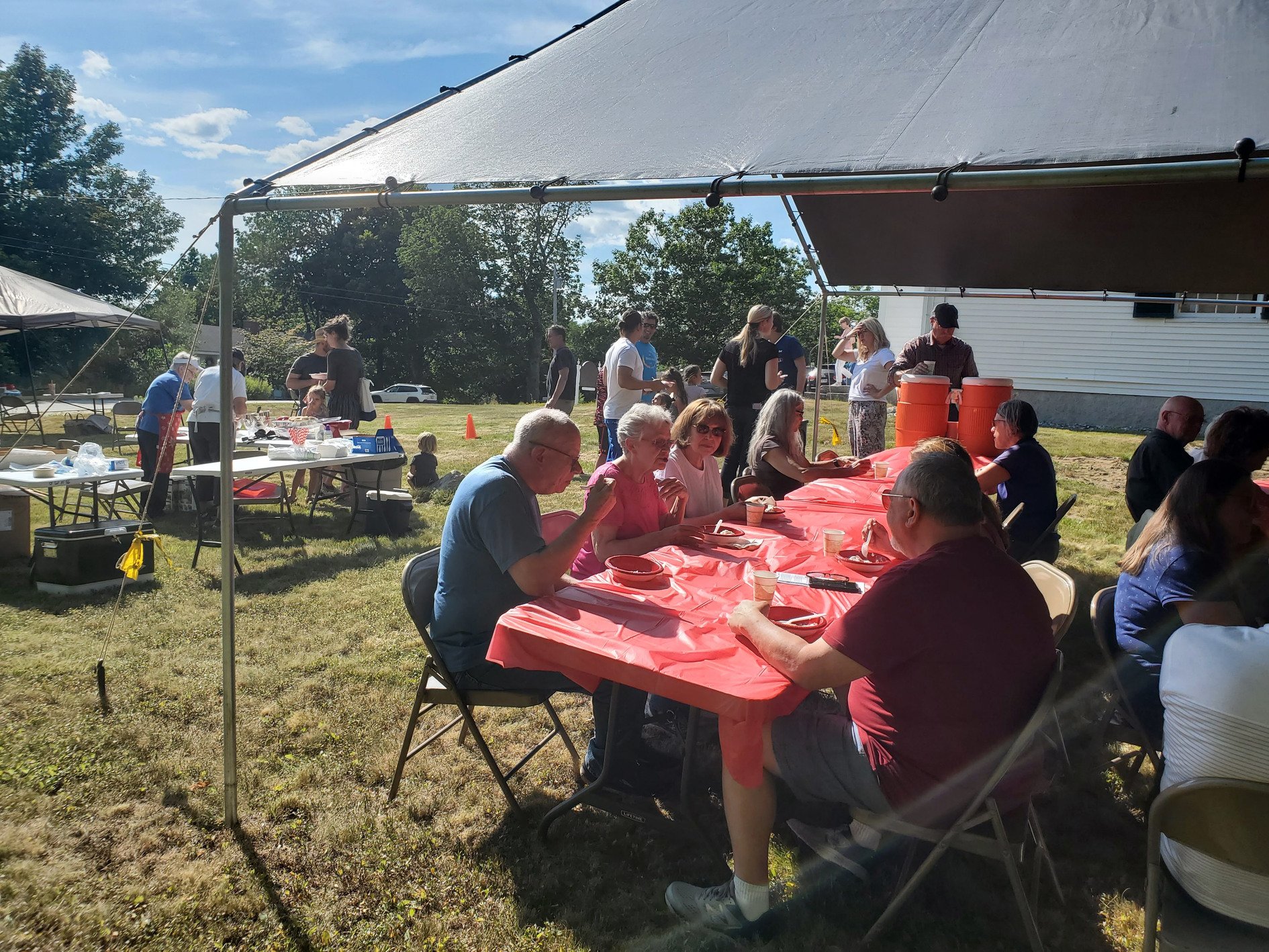 Guests gathered outdoors for refreshments at the Strawberry Festival at Bell Hill Meetinghouse.
