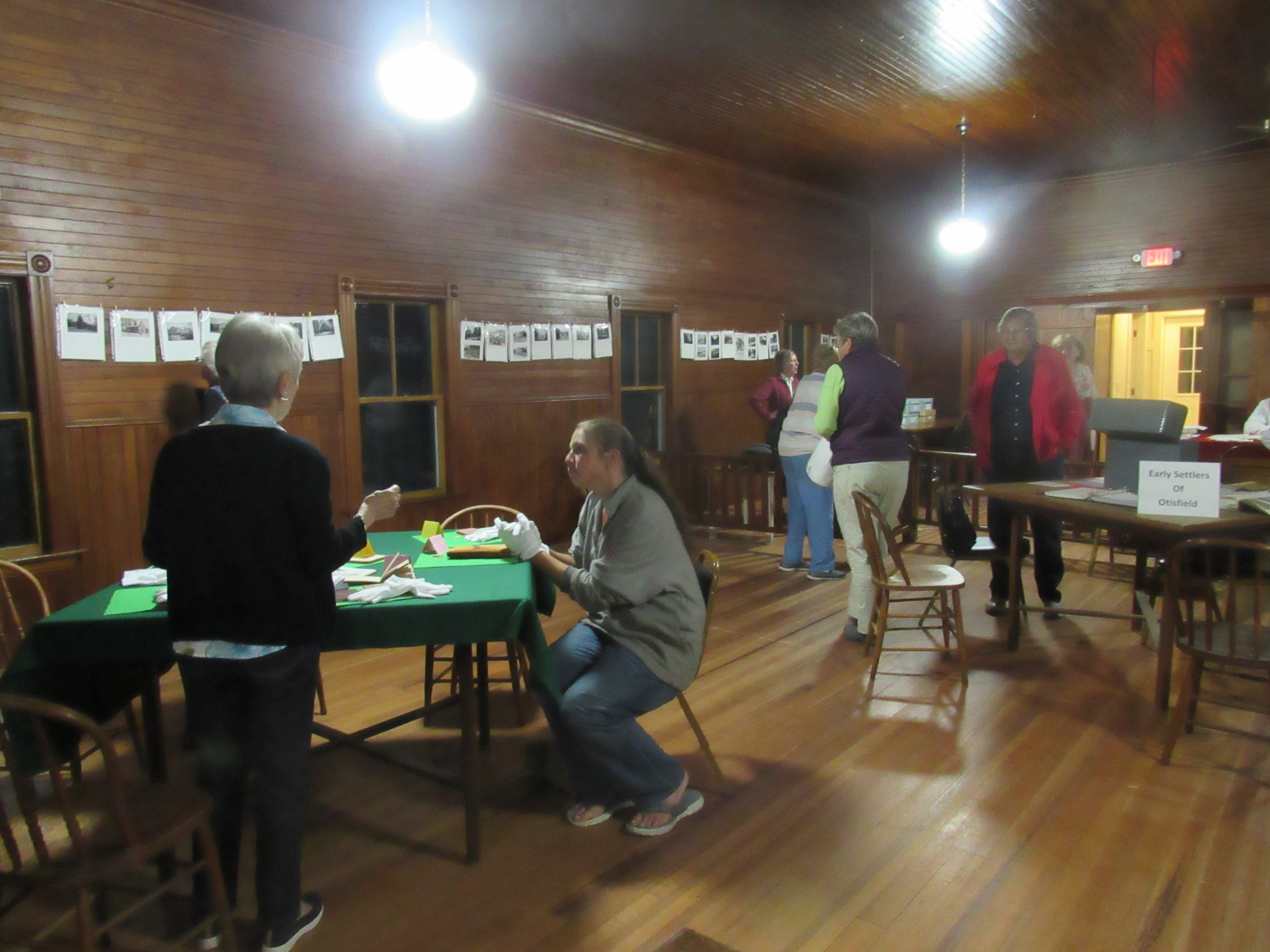 Visitors examining historical society archives