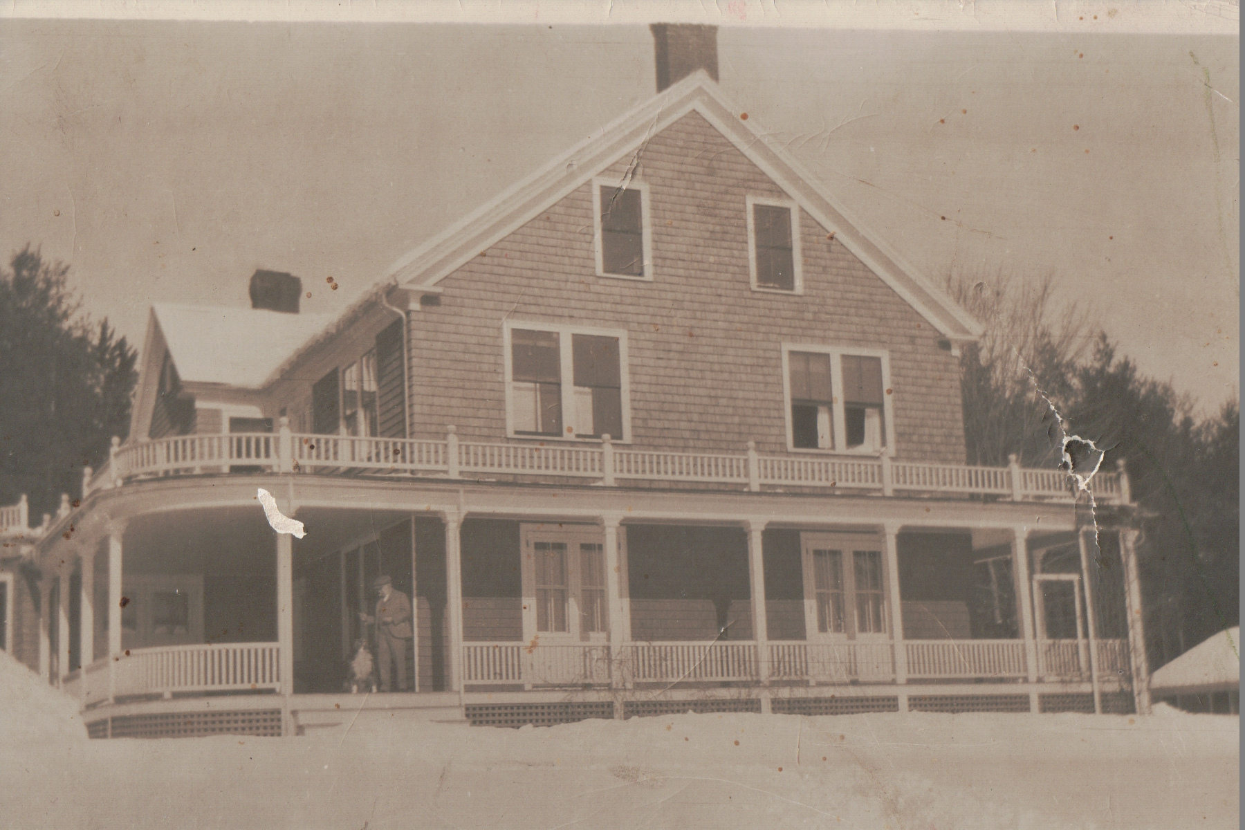 Historic building with wraparound porch — Dr. Elliot at the Cape