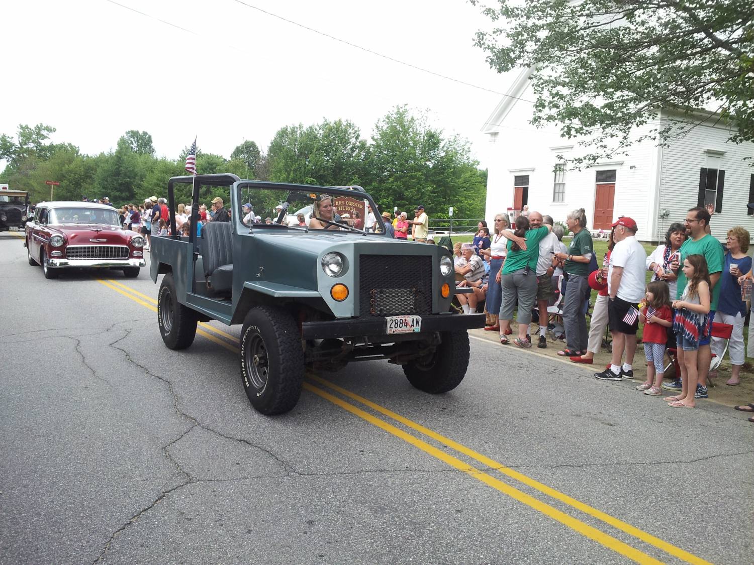 Gray open-cab utility truck at the Fourth of July parade.