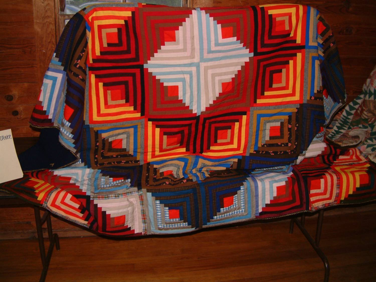 Ethel Turner quilt, formerly Mrs. Elliot's, with concentric square patchwork.