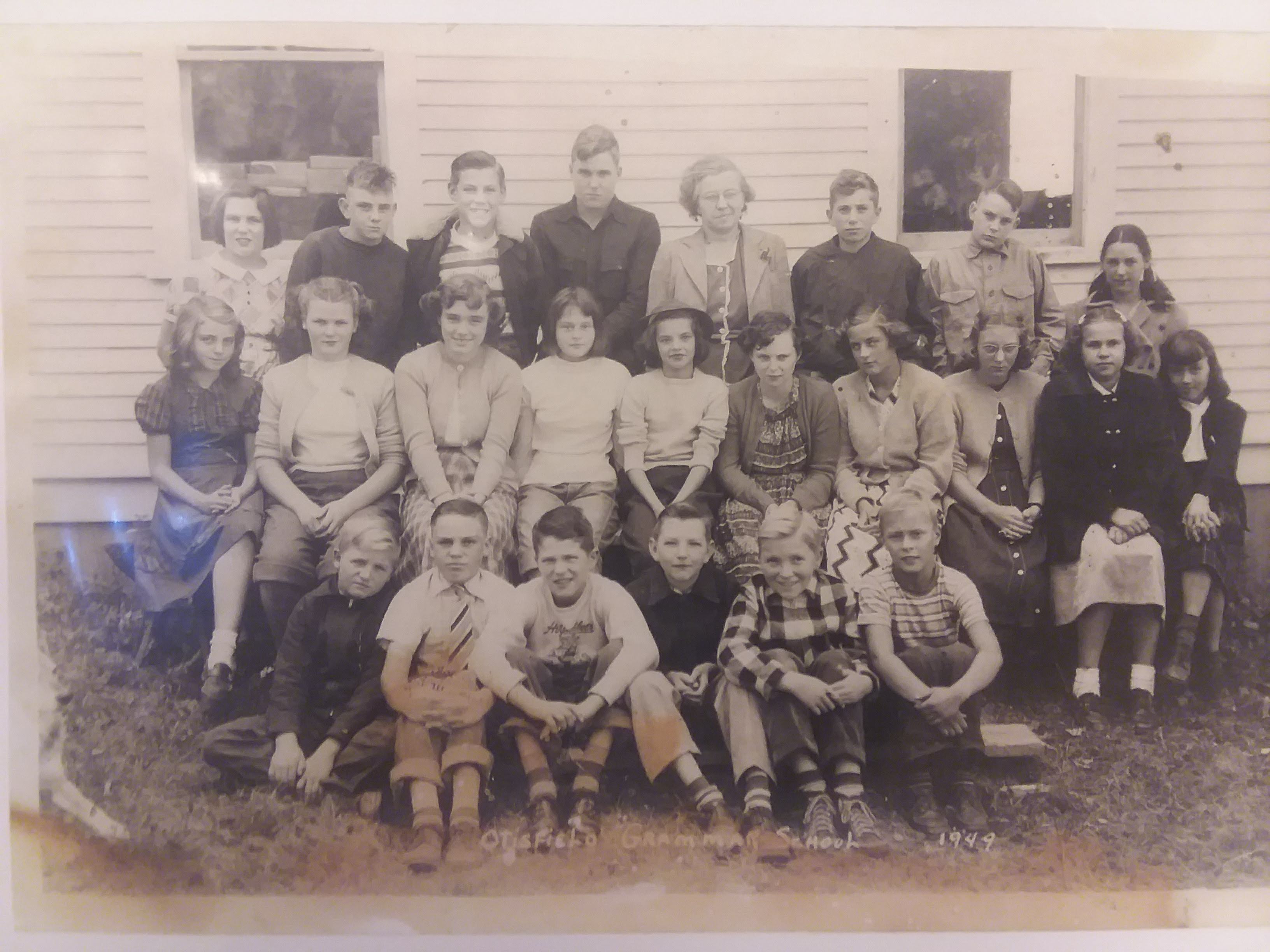 Otisfield grammar school grades 6–8, 1949. A companion identification sheet records the names associated with this photograph.