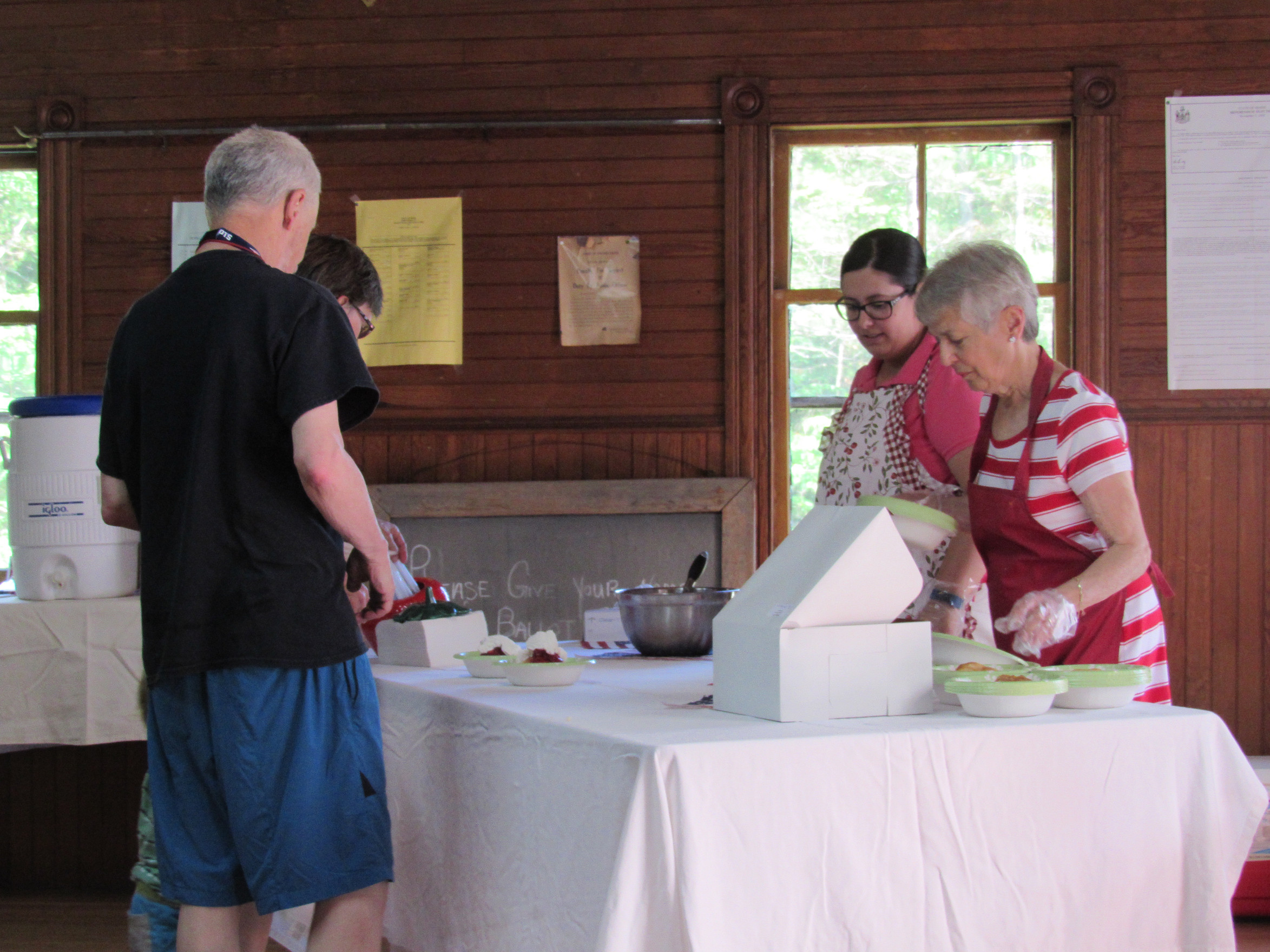 Secretary Jean Pottle and Volunteer Jessica Dorr serve some of our first customers at the 2017 Strawberry Festival
