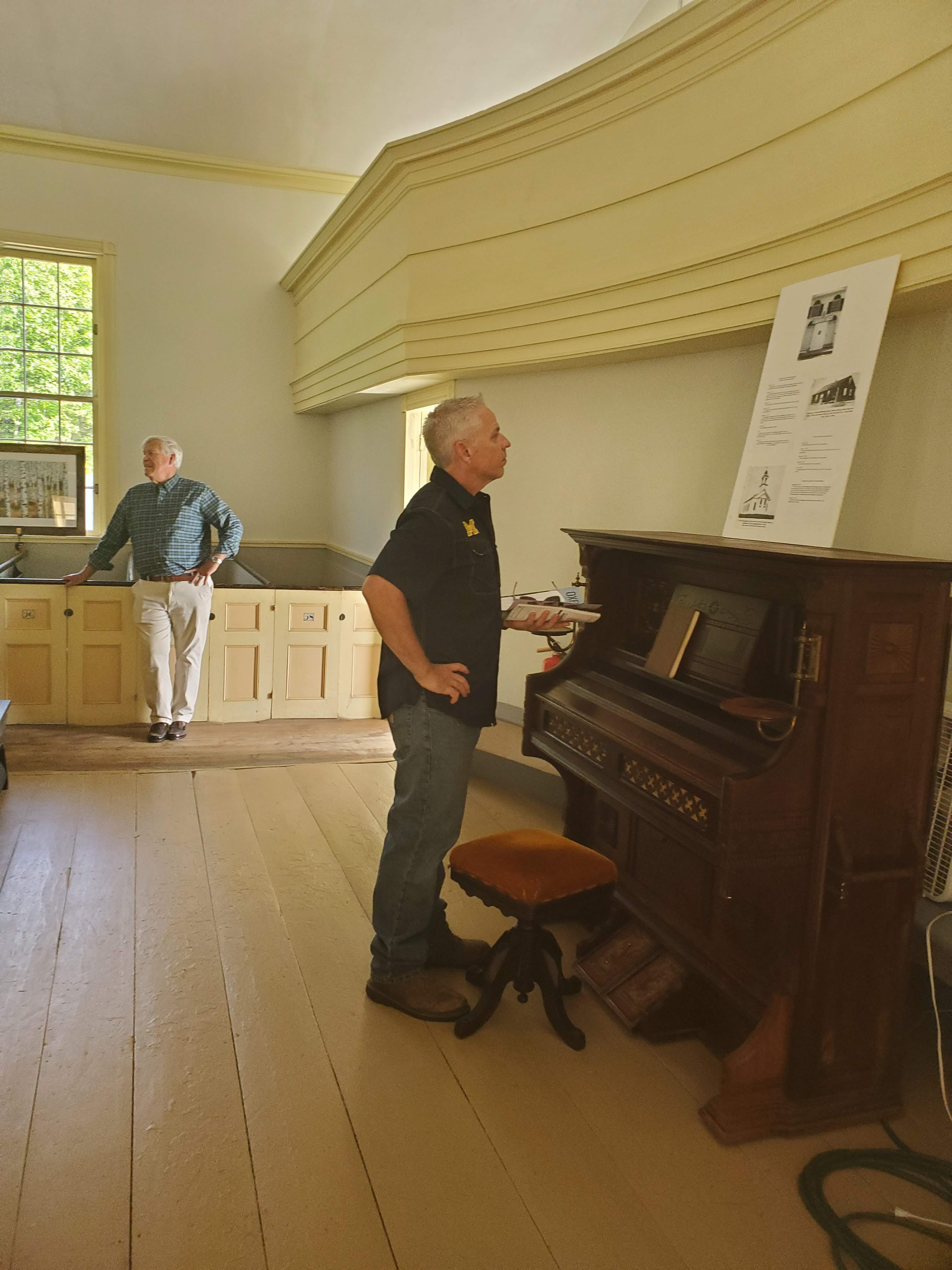 Visitors and displays inside the meetinghouse
