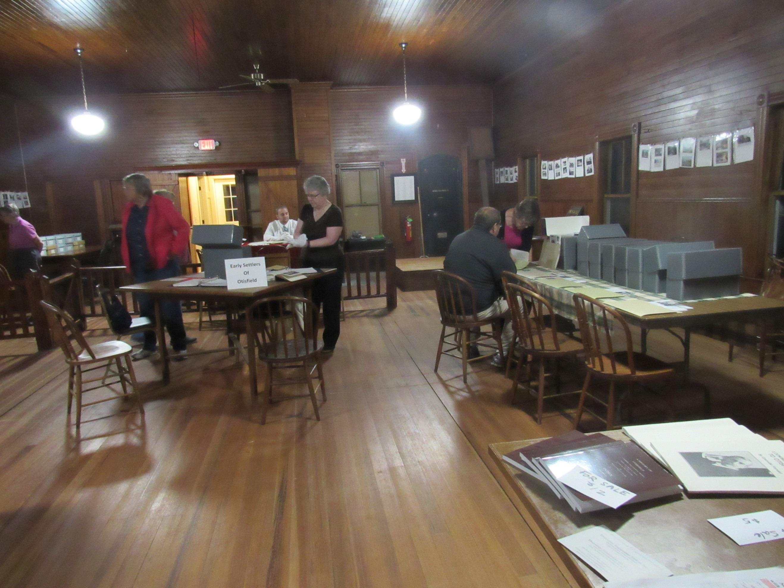 Visitors examining historical society archives