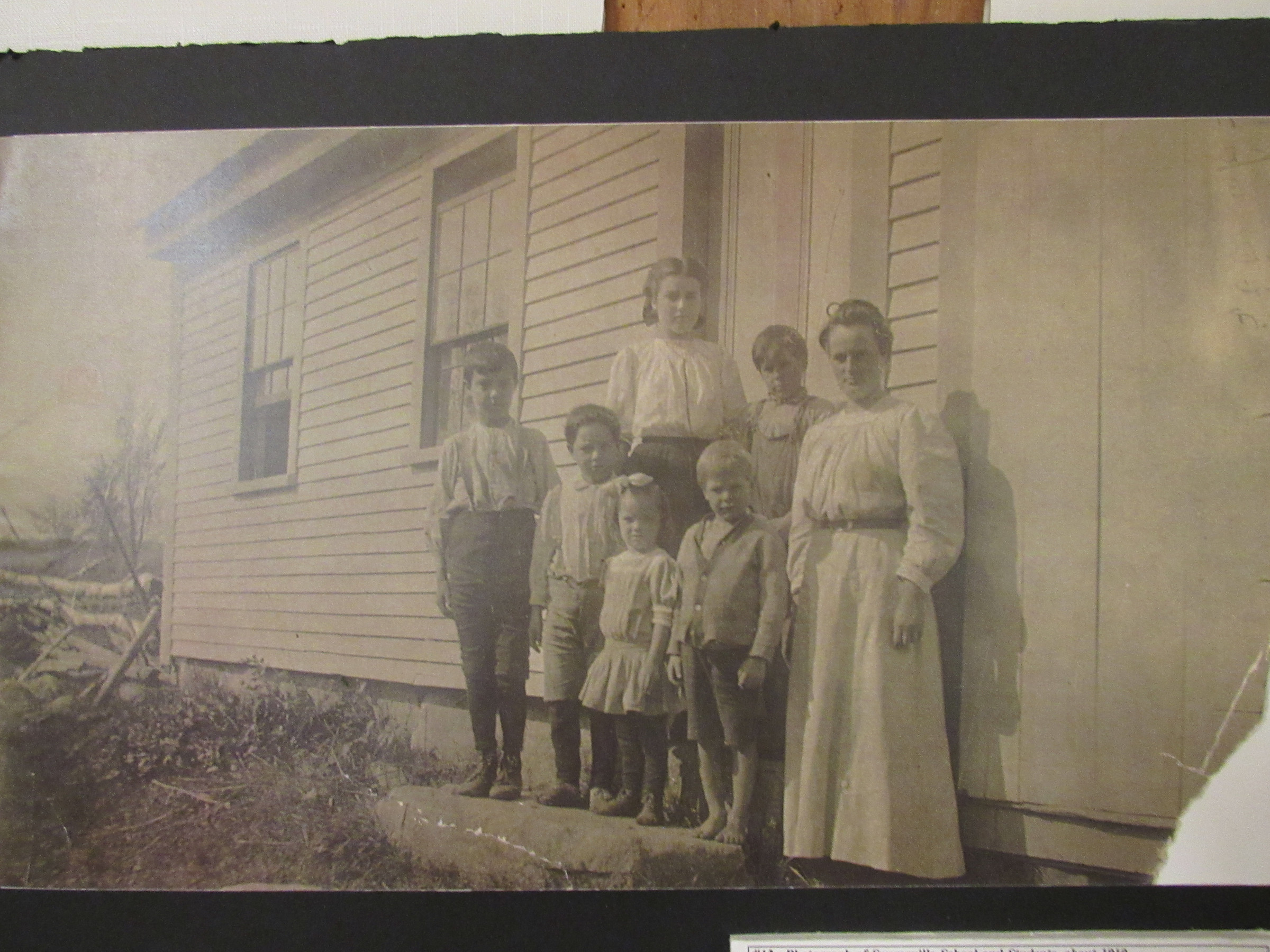 Swampville School pupils and teacher, about 1910. A companion identification sheet records the names associated with this photograph.