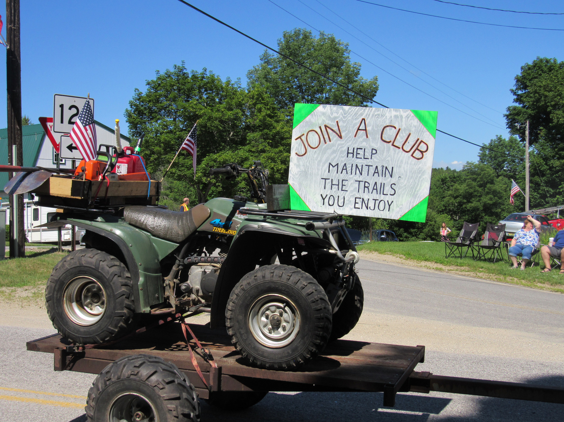 ATV trailer promoting trail maintenance at the Fourth of July parade.