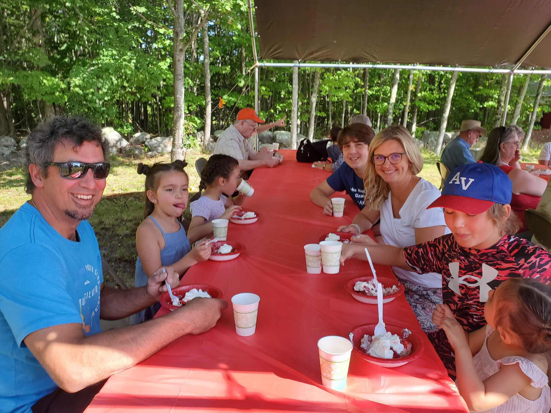 Guests gathered outdoors for refreshments at the Strawberry Festival at Bell Hill Meetinghouse.