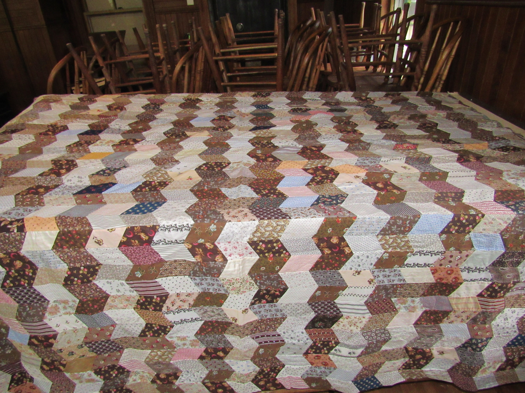 Geometric patchwork quilt at the women's textiles display.