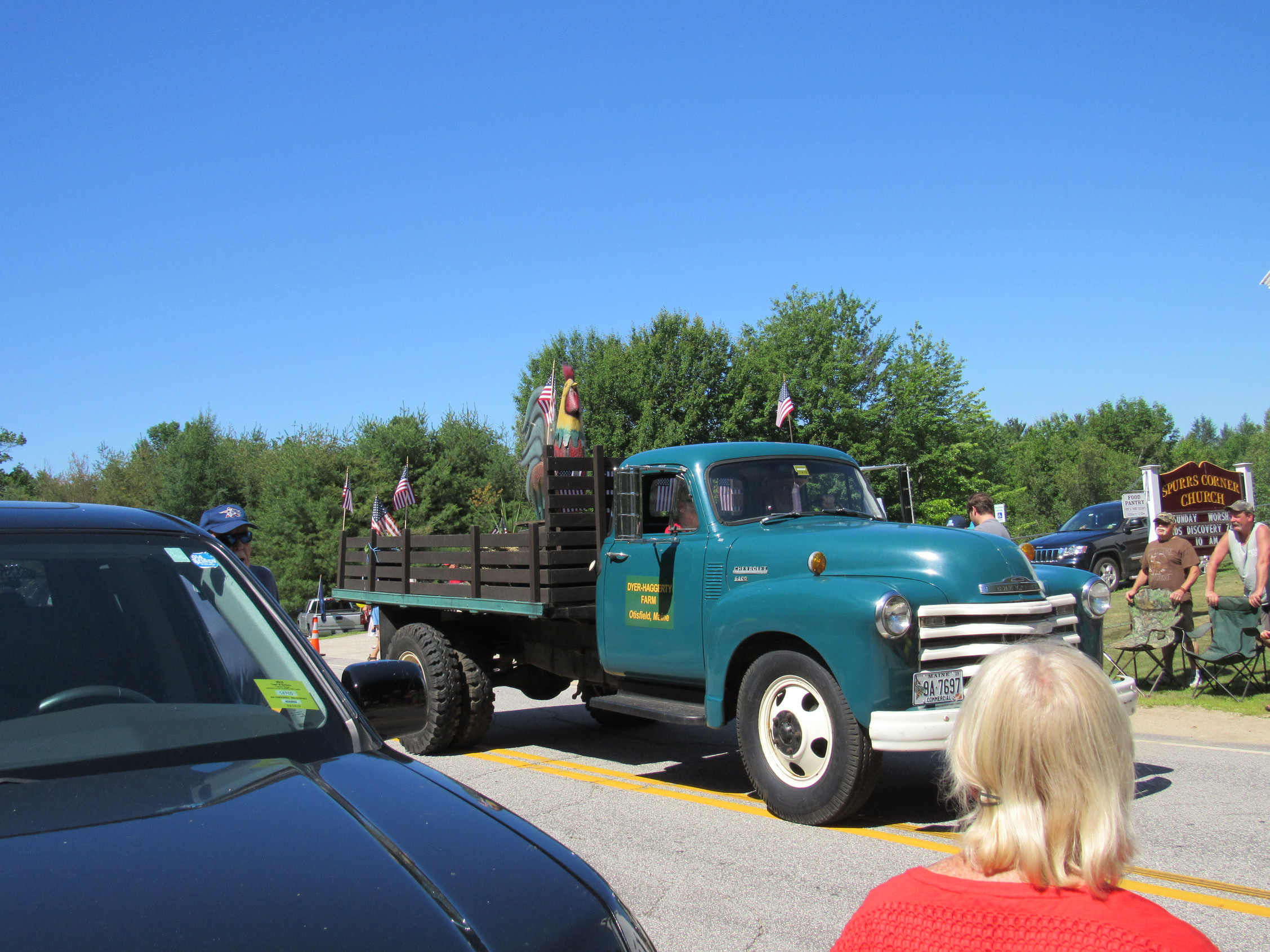 Vintage green stake-bed truck at the Fourth of July parade.