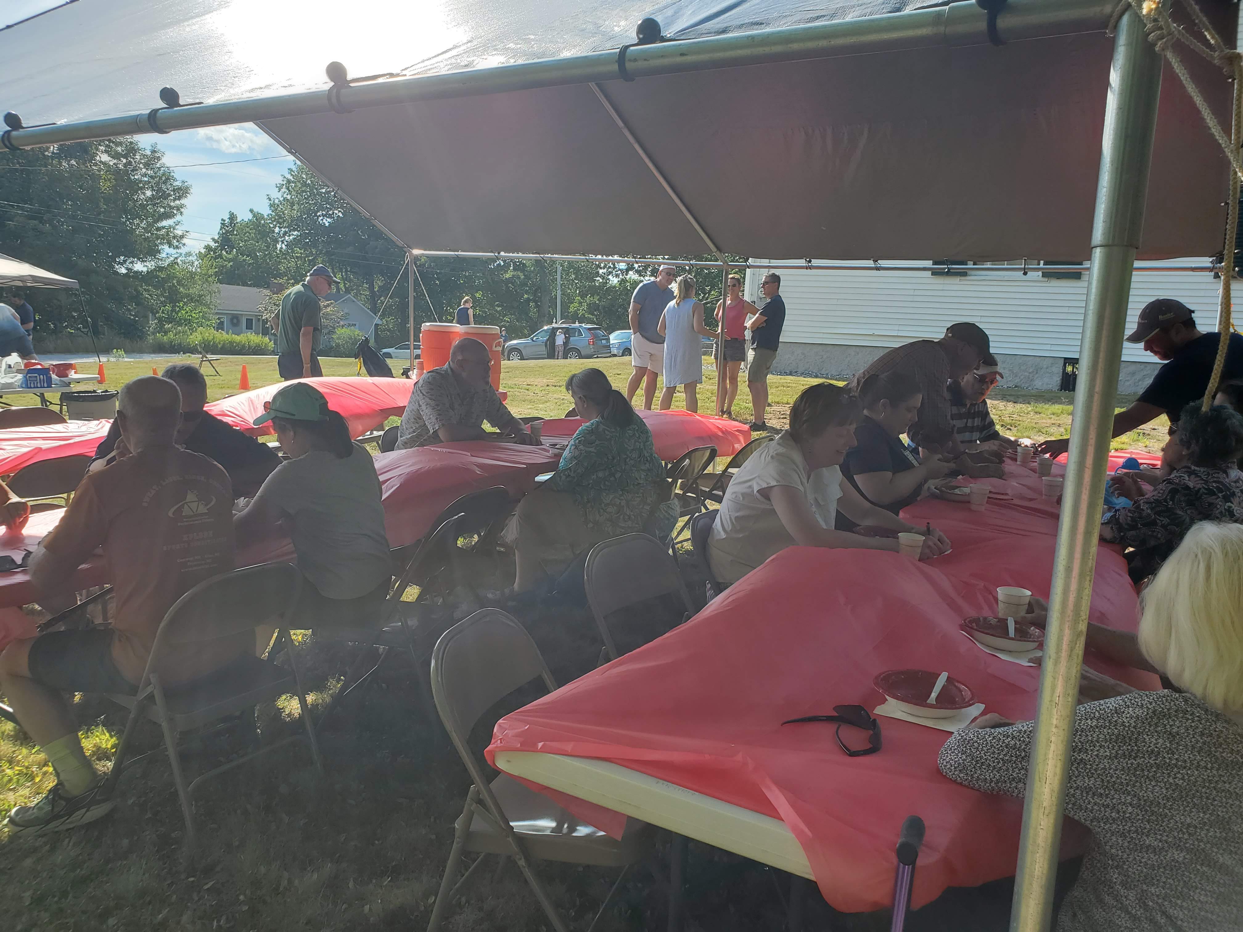 Guests gathered outdoors for refreshments at the Strawberry Festival at Bell Hill Meetinghouse.