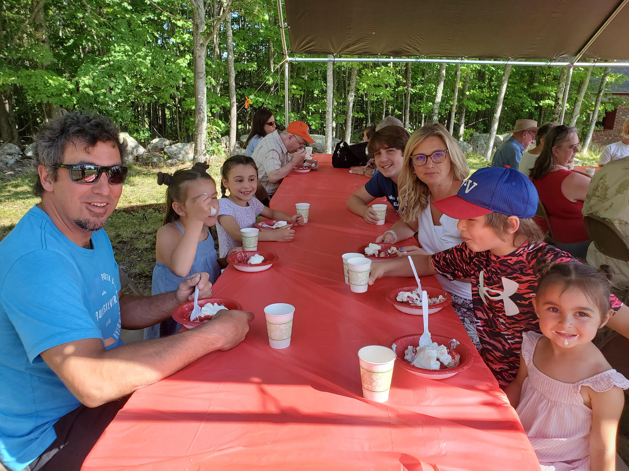 Guests gathered outdoors for refreshments at the Strawberry Festival at Bell Hill Meetinghouse.
