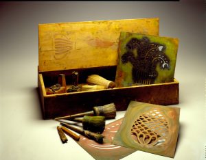 The stencil kit of Moses Eaton, Jr. A wooden box containing Moses Eaton’s stencils and brushes.