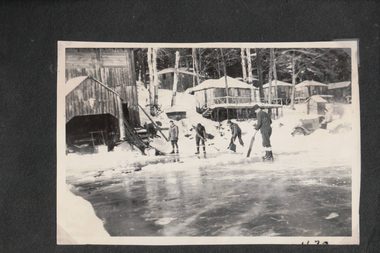 Ice cutting, with Ohuivo buildings in background, from Tucker album, 1940s