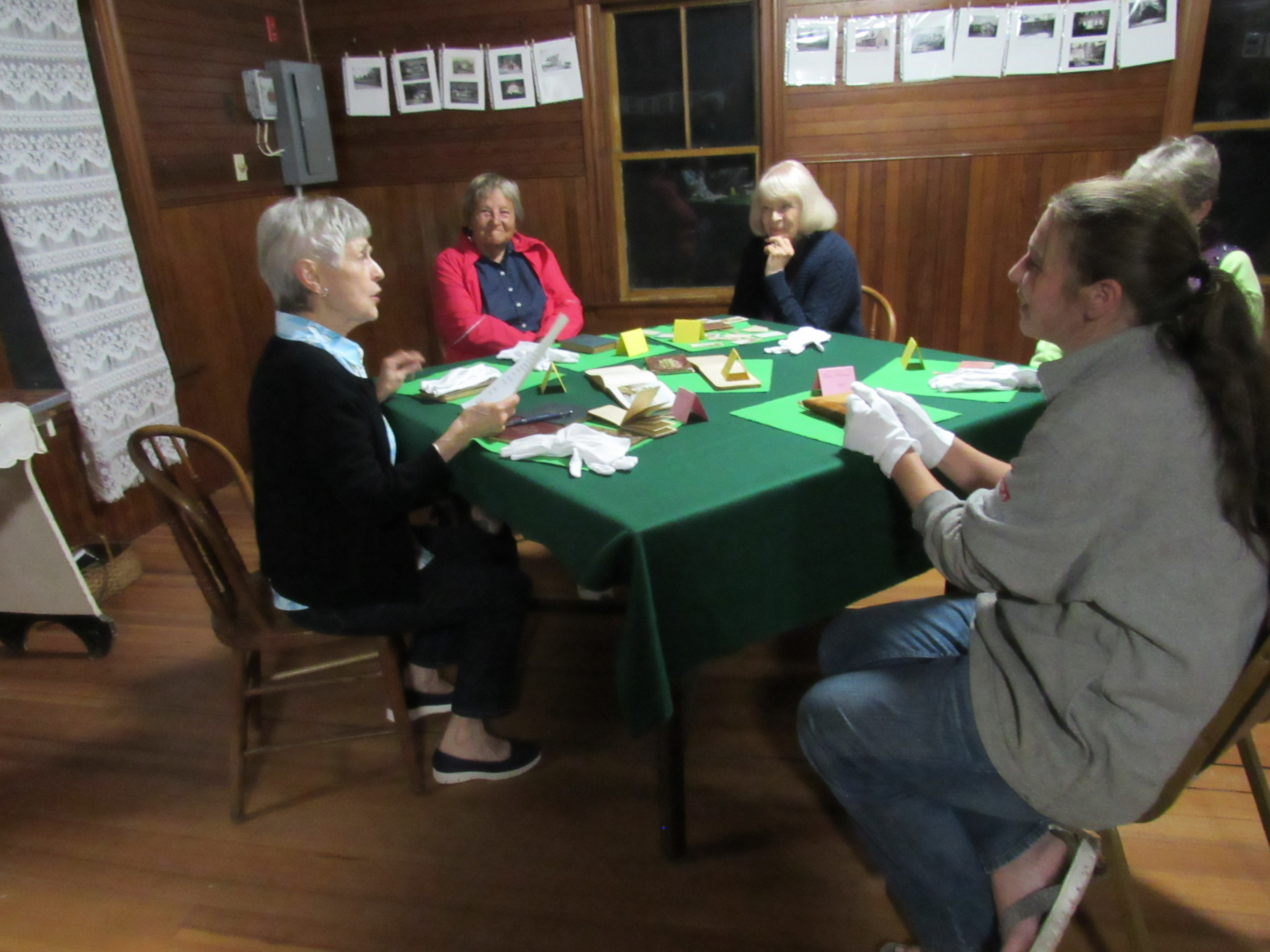 Visitors examining historical society archives